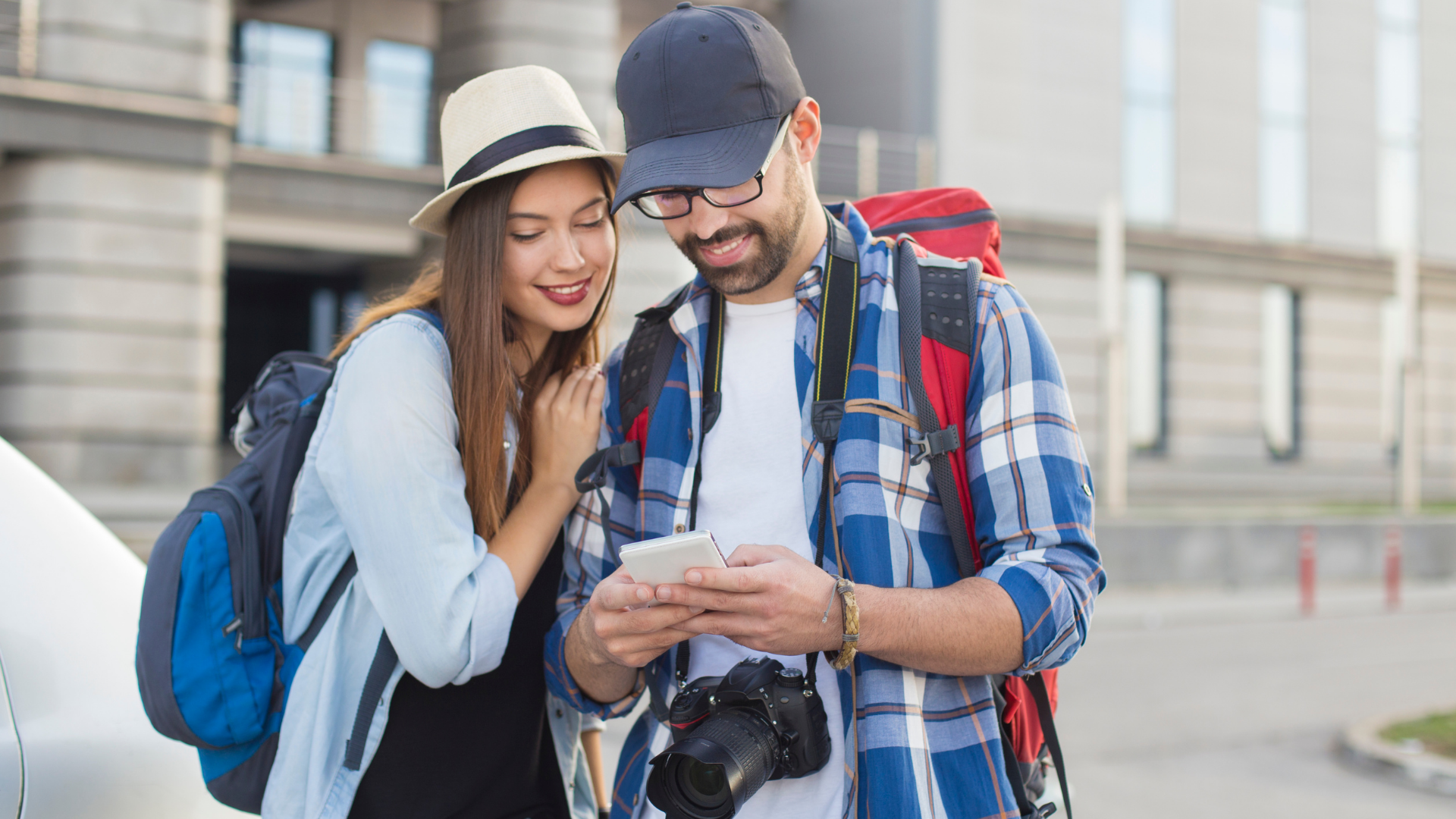 Travellers looking at tour options to make booking on mobile
