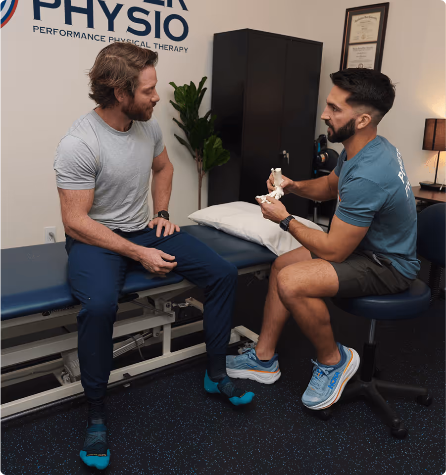 Patient performing single-leg squat exercise during sports physical therapy session in Charlotte, NC