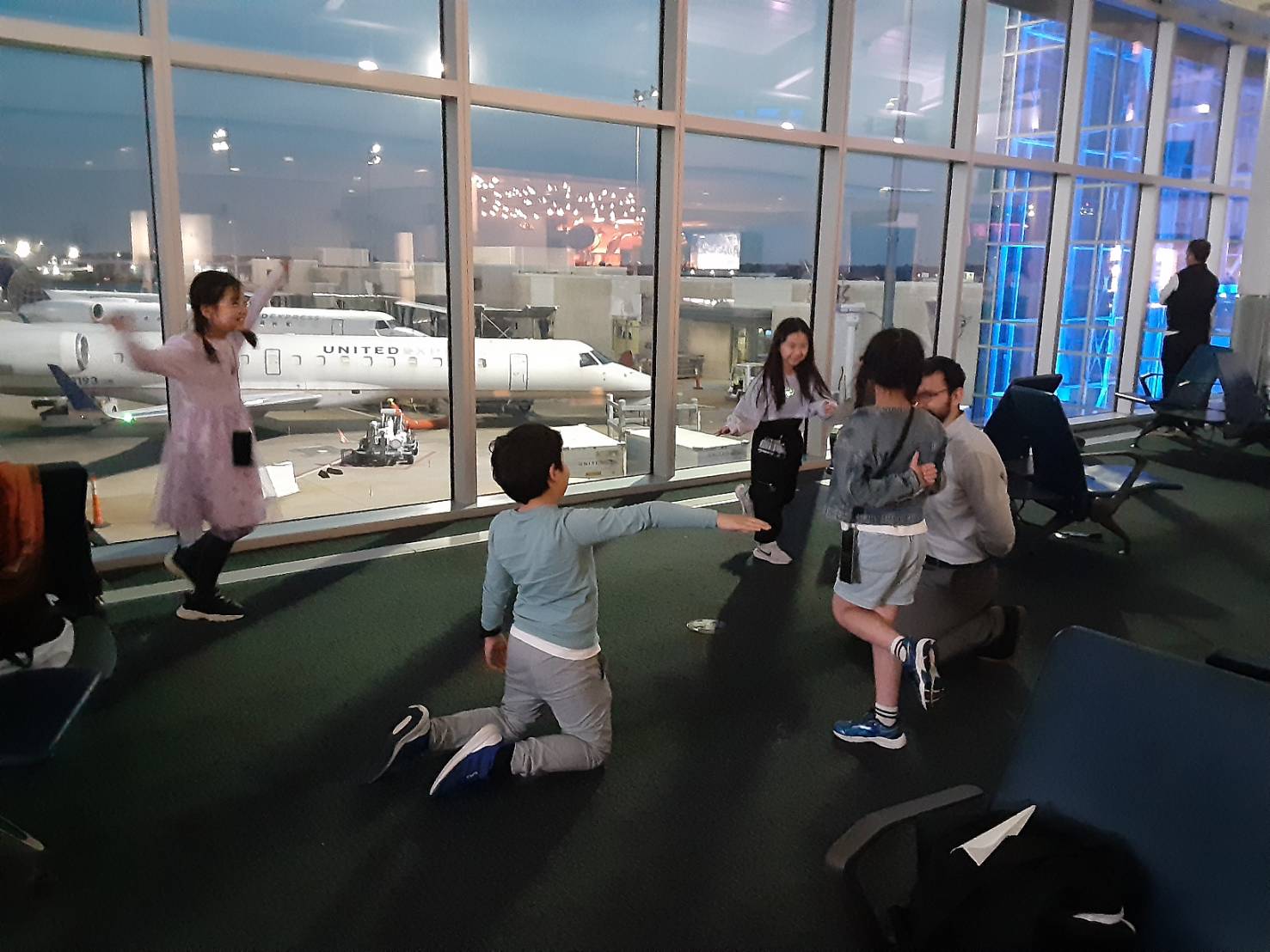 our students and teacher awaiting takeoff to the USA