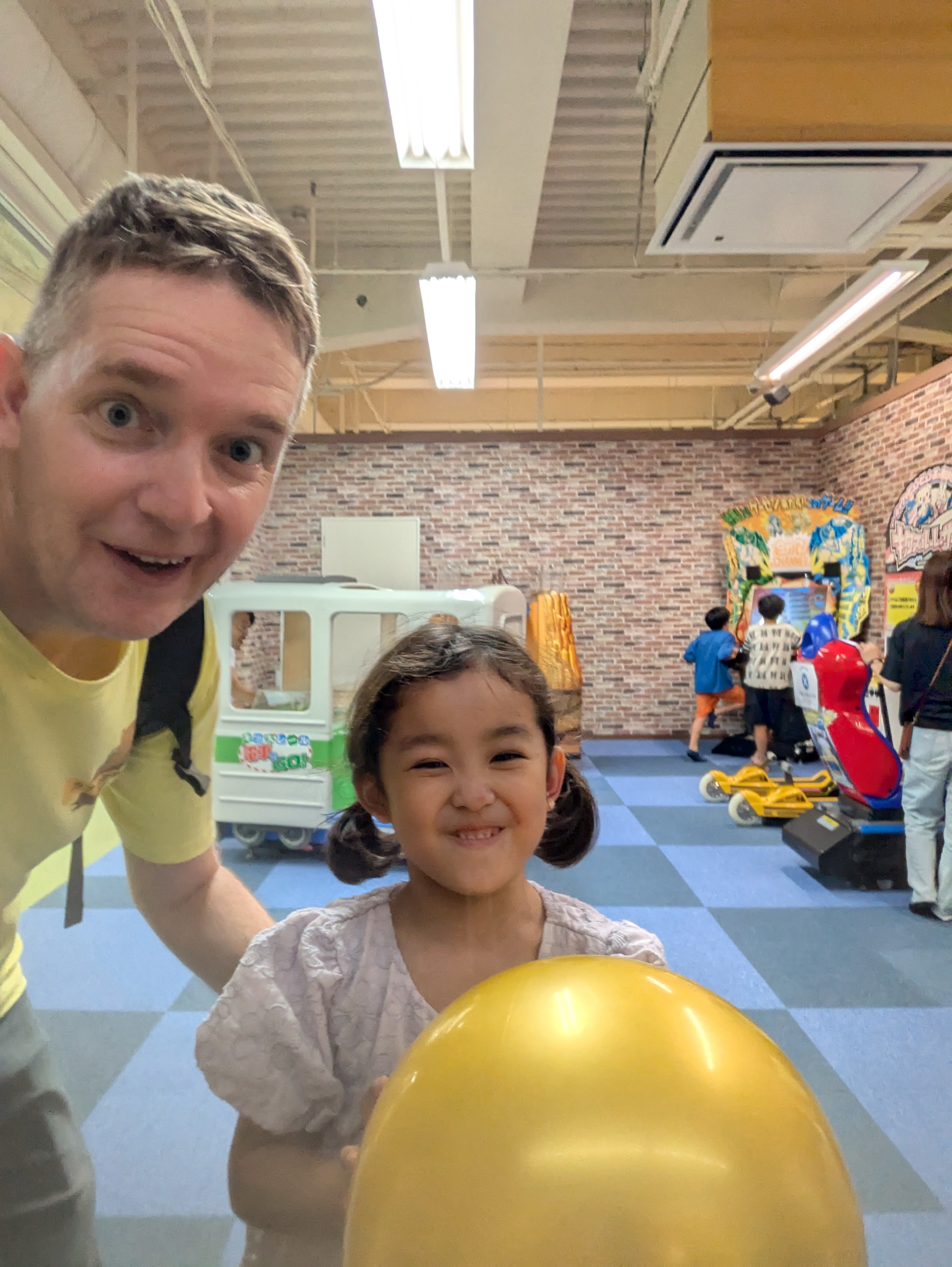 Teacher interacting with students at a public venue in English