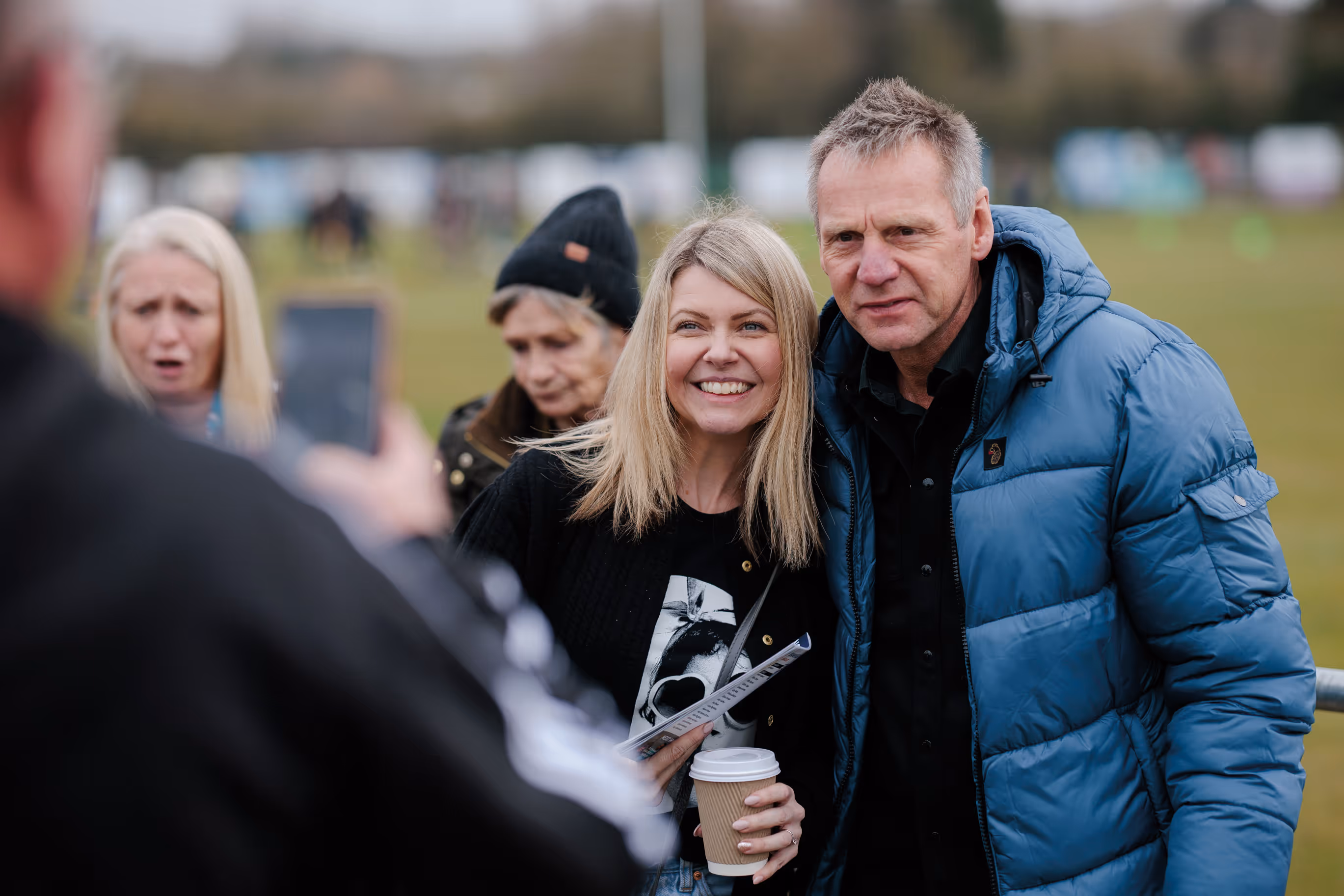 Former England captain Stuart Pearce poses for a photo with a fan.