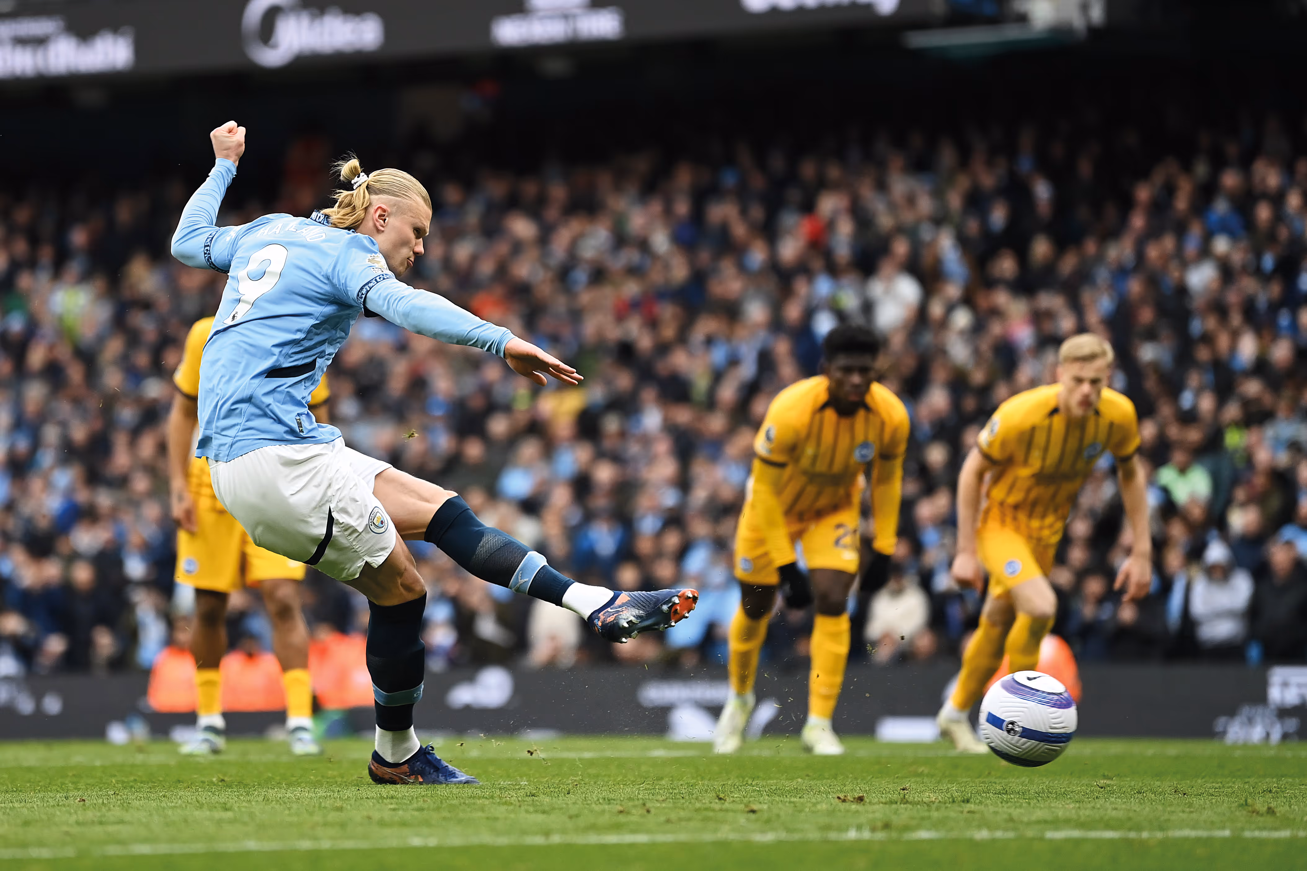 Manchester City forward Erling Haaland scores a penalty against Brighton & Hove Albion.