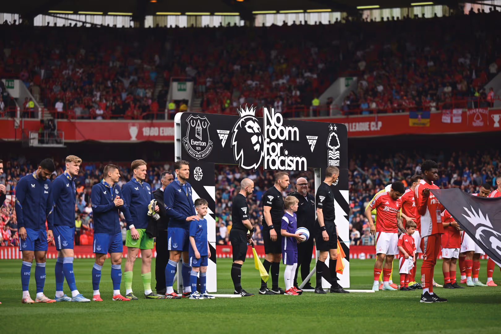 Everton and Nottingham Forest players line up pre-match under the No Room For Racism board.