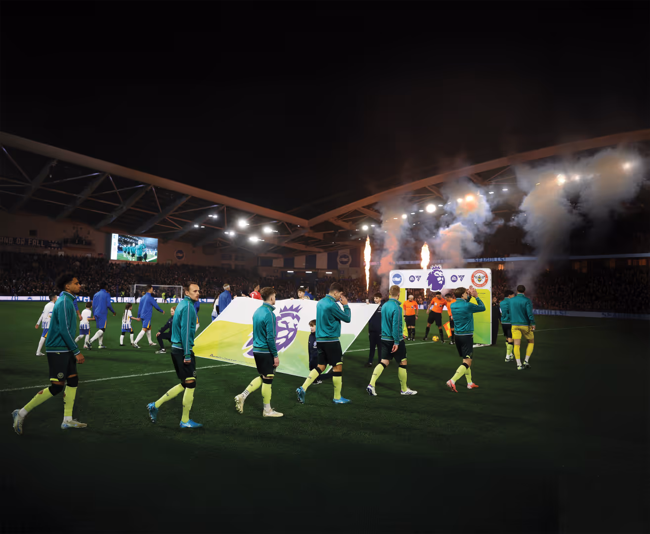 Brentford players walk-out pre-match at Brighton & Hove Albion's Amex Stadium.