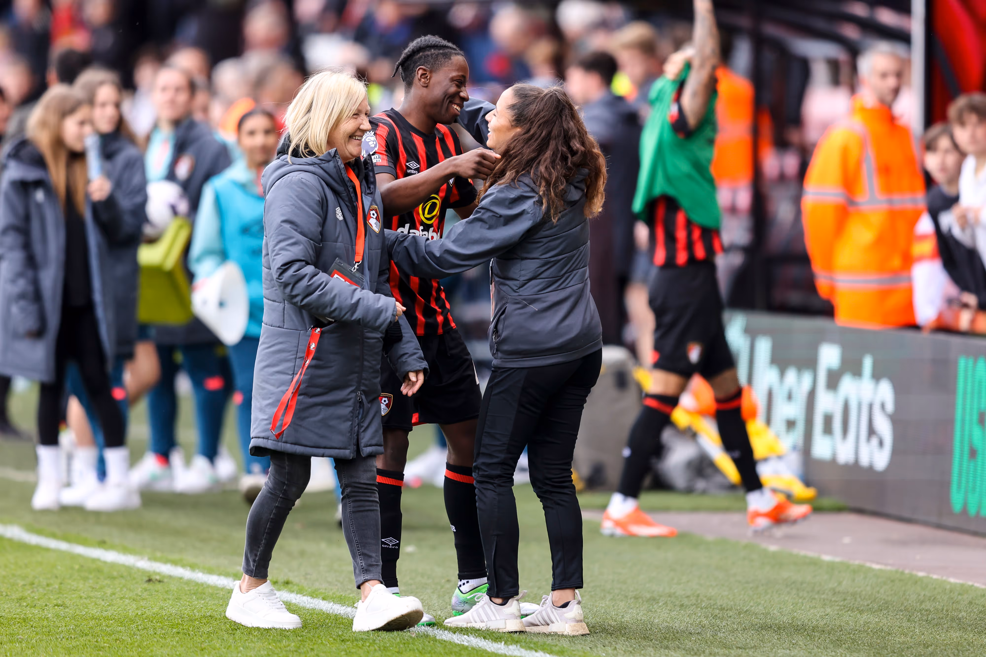 Future Academy Leaders participant Chloe McCombie celebrates with a player and colleague.
