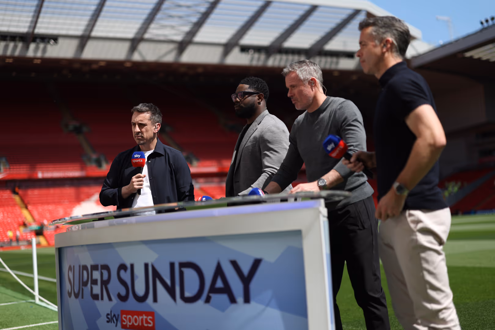 Sky Sports pundits Gary Neville, Micah Richards and Jamie Carragher prepare to broadcast alongside presenter David Jones at Anfield.