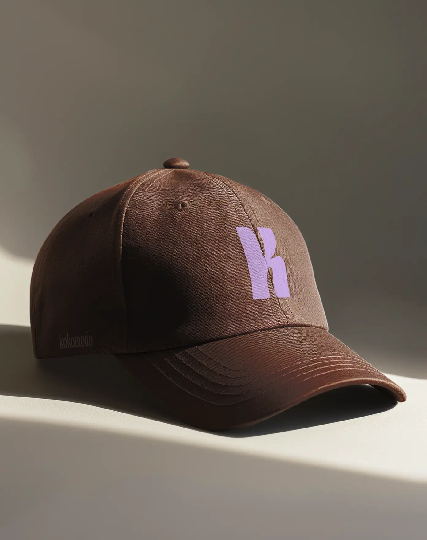 Kokomodo branded cap — violet K monogram merchandise