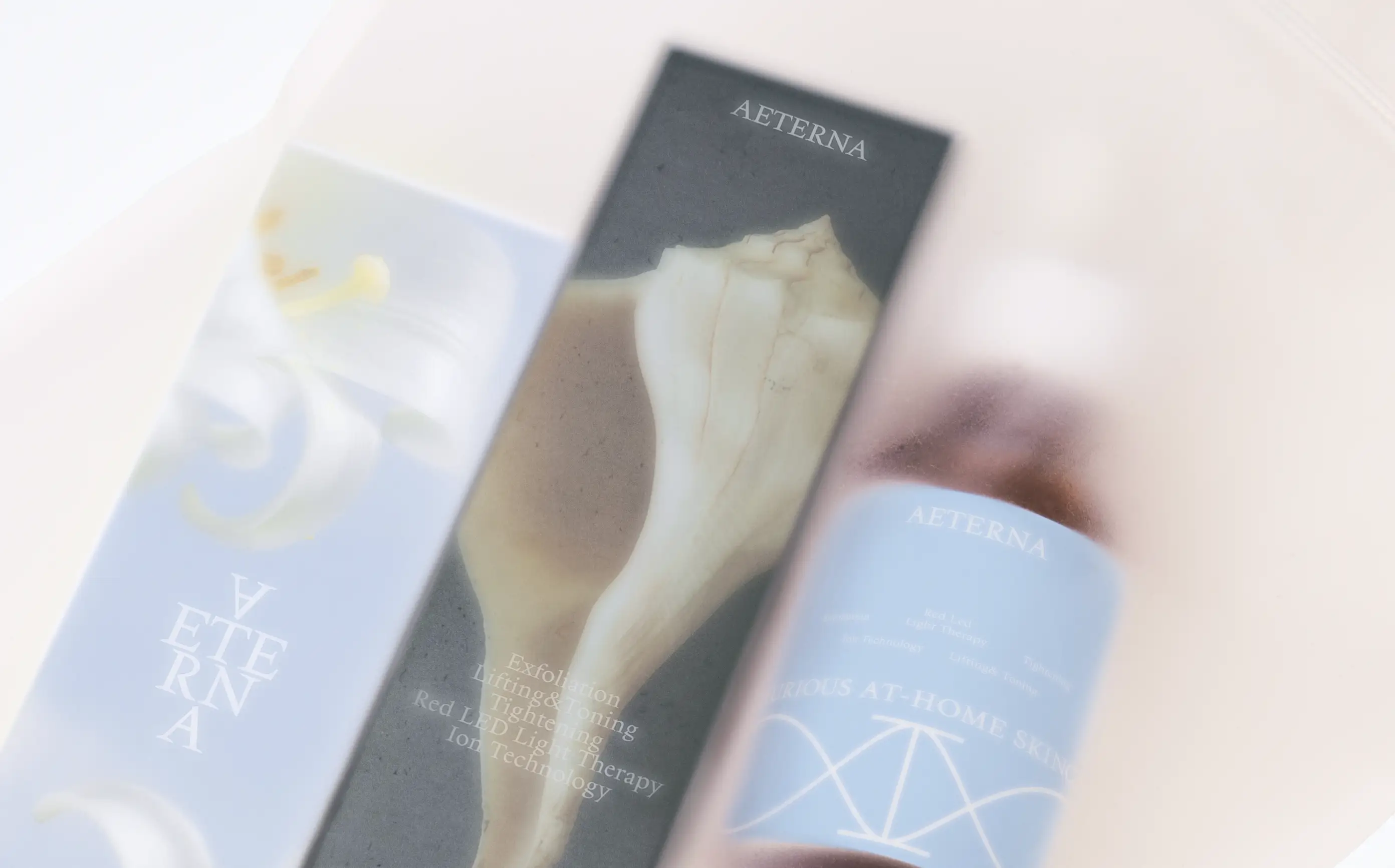 Aeterna skincare packaging design — mineral-blue box and serum