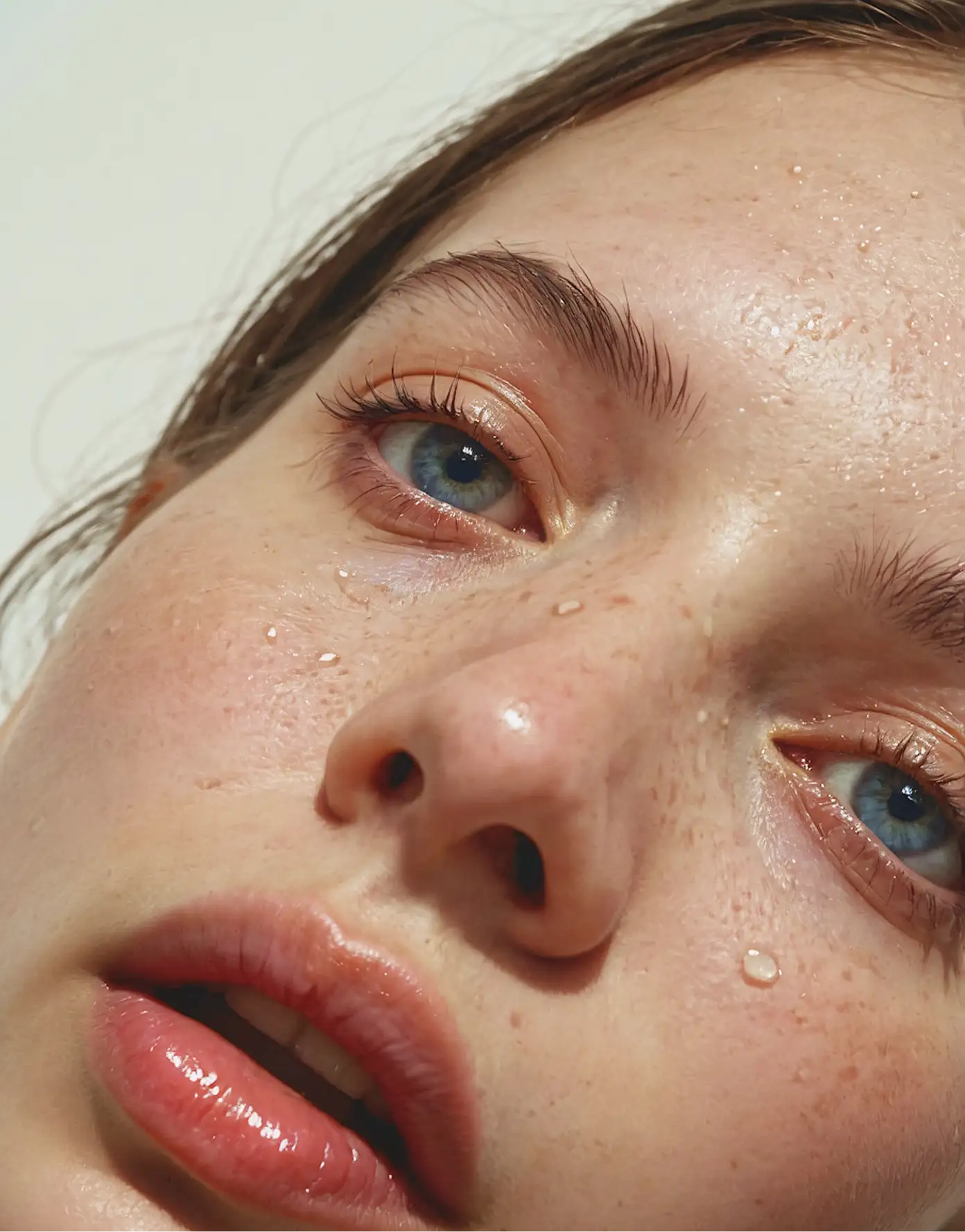 Aeterna skincare visuals — natural dewy complexion close-up