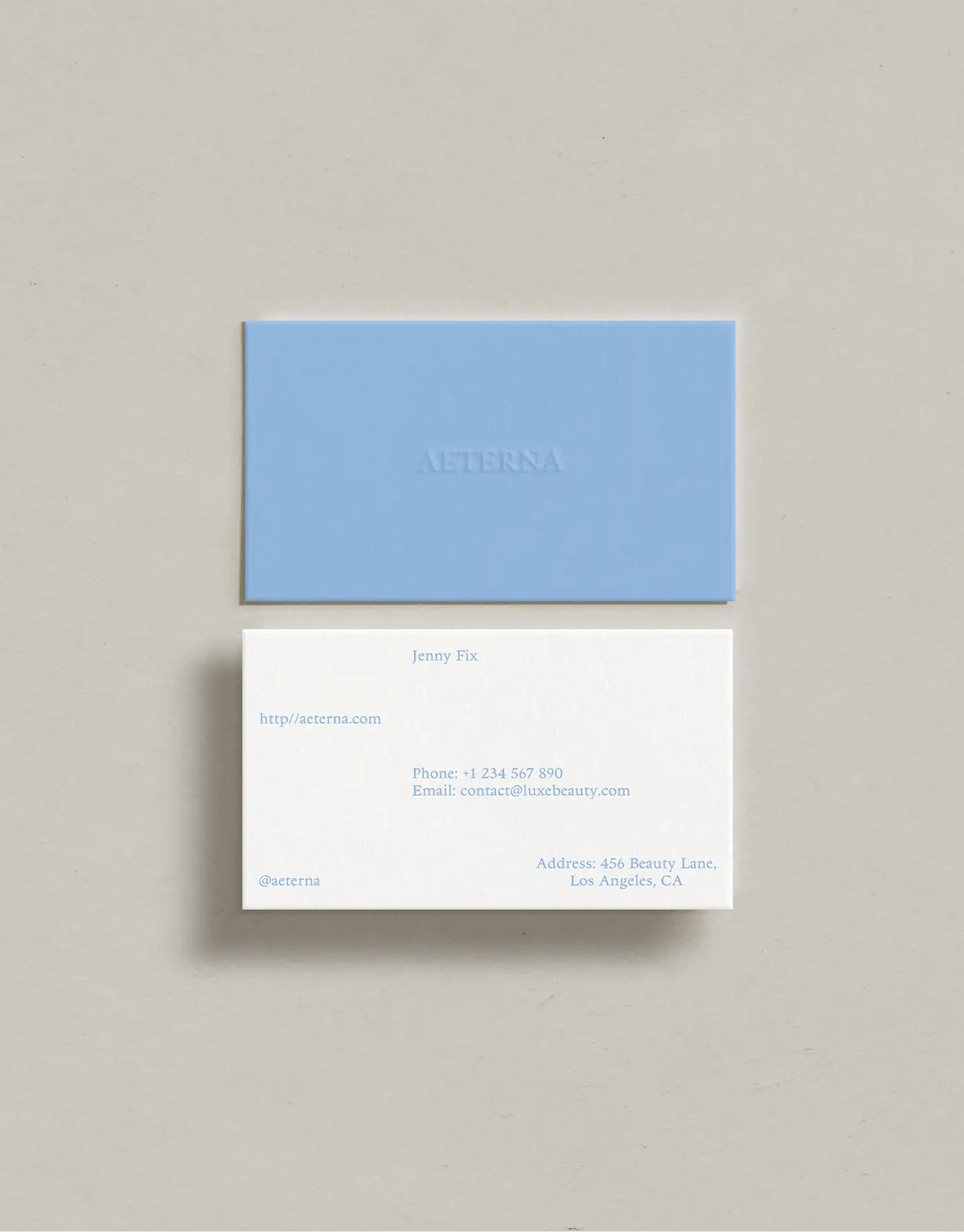 Aeterna stationery design — mineral-blue business cards & serif wordmark
