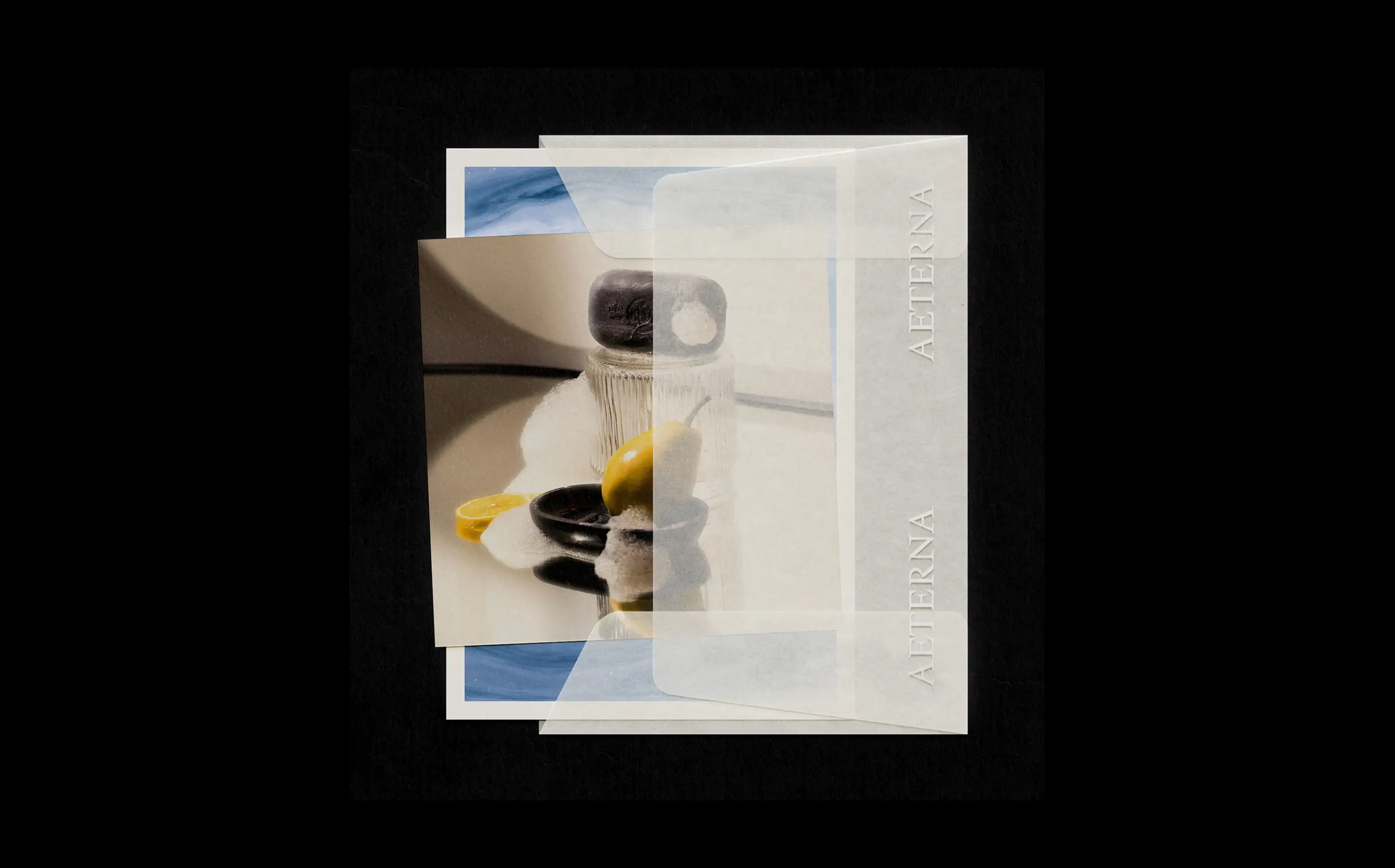 Layered print collage — translucent vellum with product still life