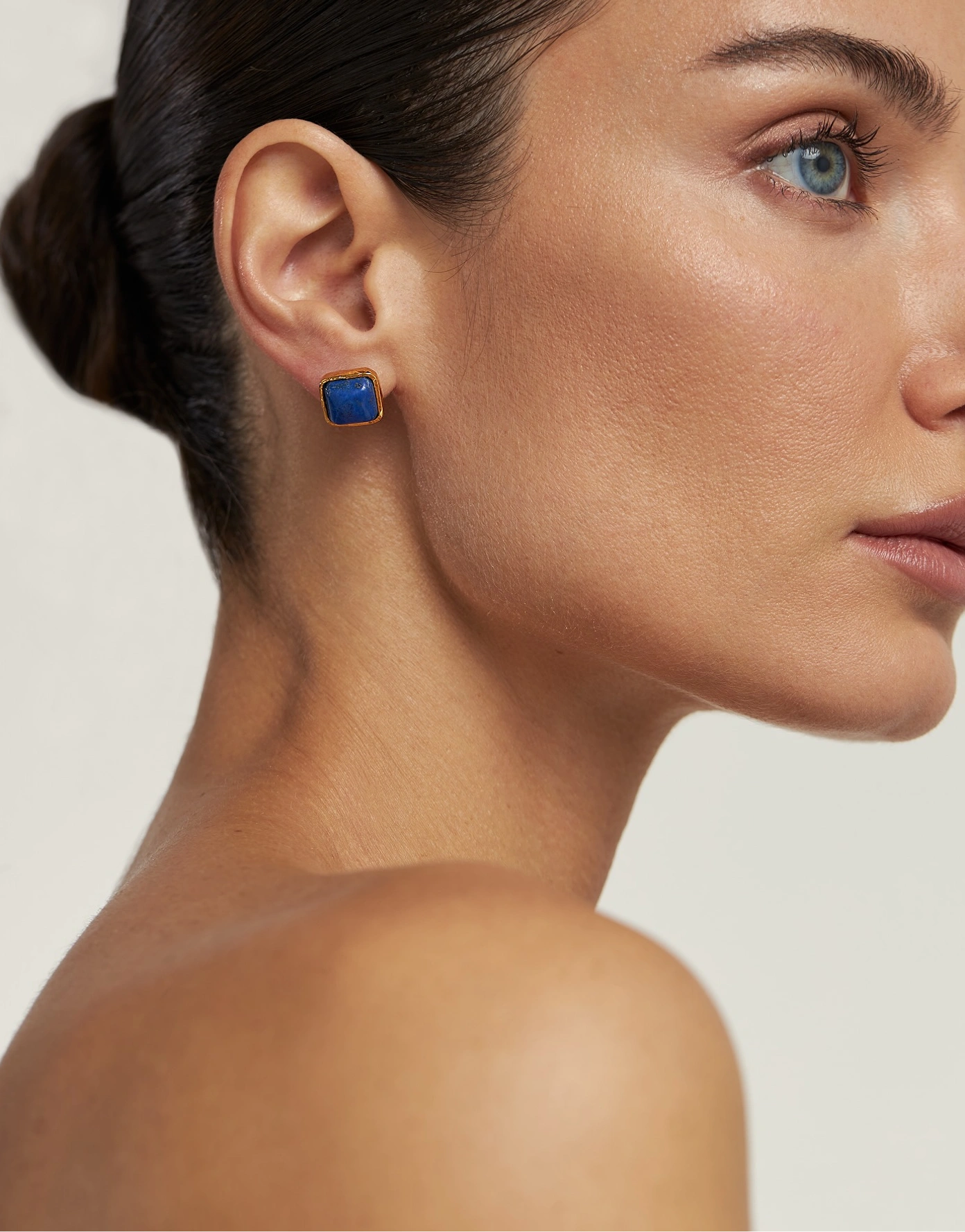 Jewelry brand photography — lapis stud earring close-up