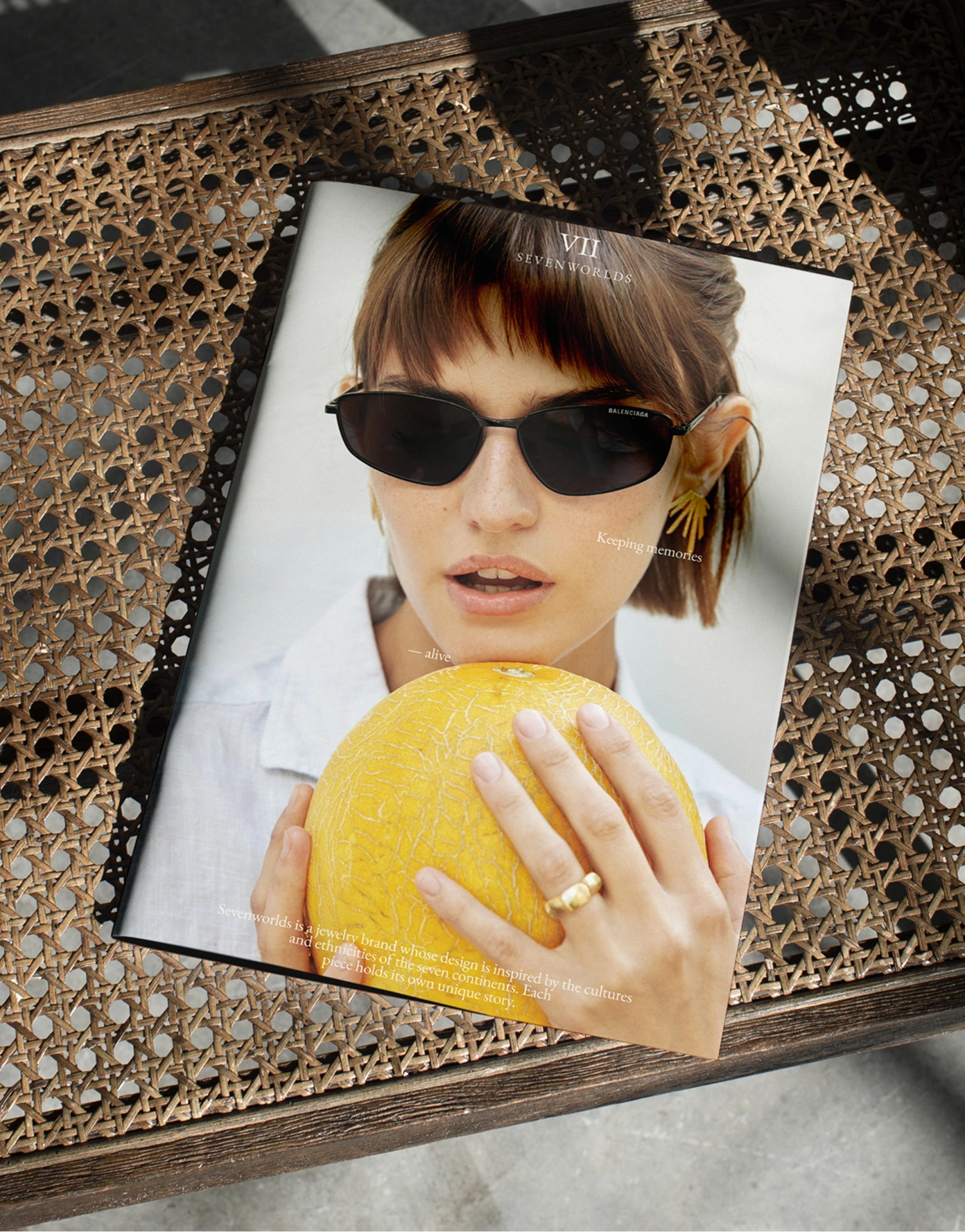 Branded lookbook — ring stack lifestyle shot on rattan