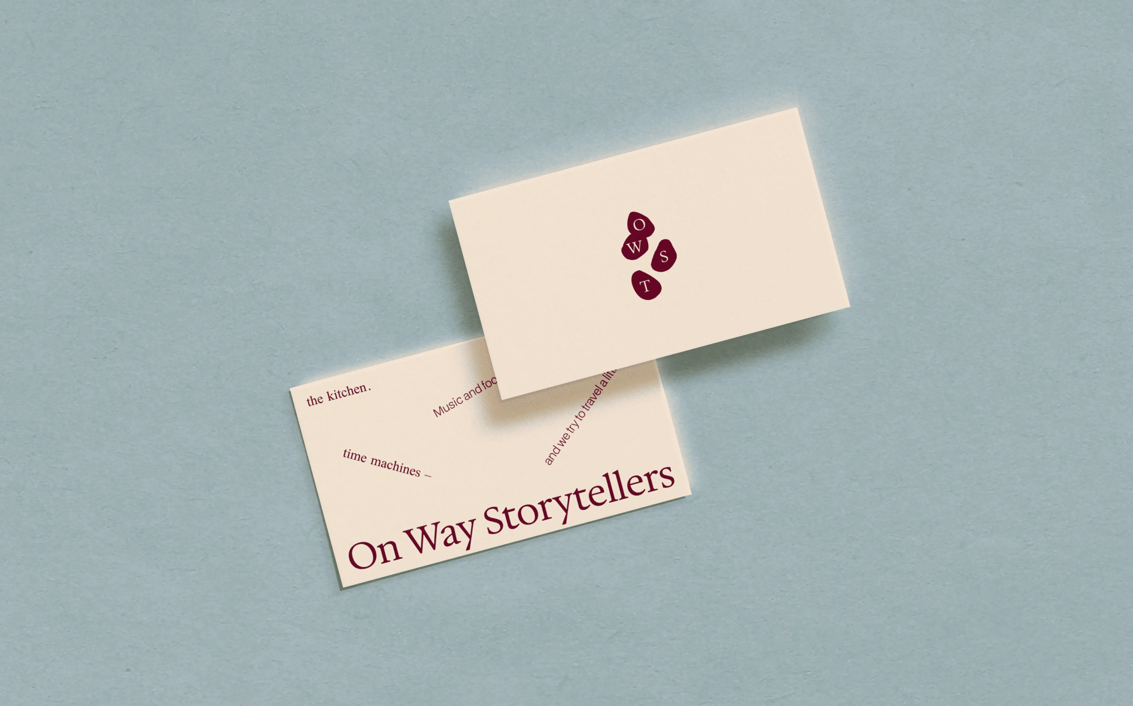 Business cards with the On Way Storytellers logo and wordmark.