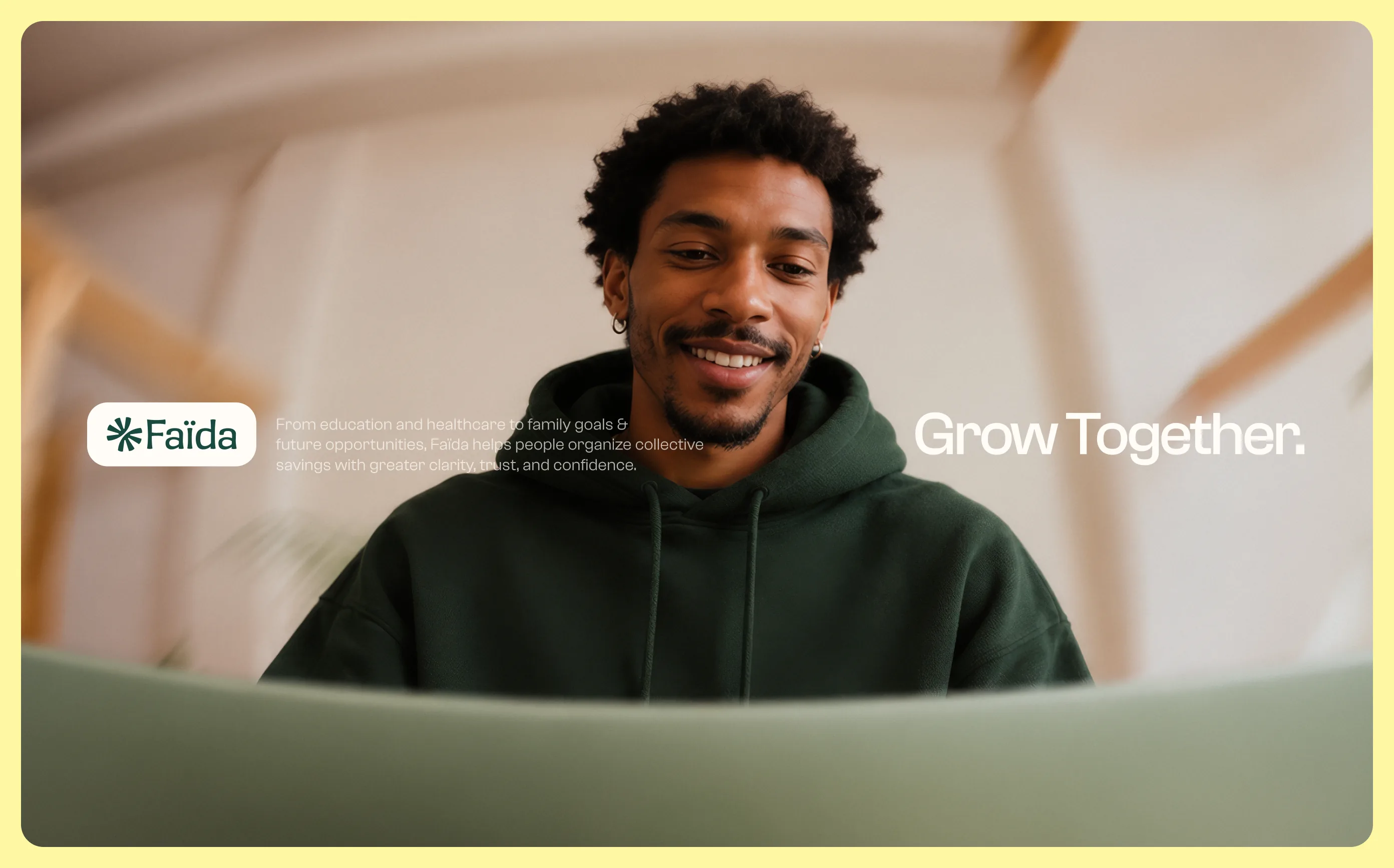 Smiling man in a green hoodie, Faïda campaign visual: Grow Together