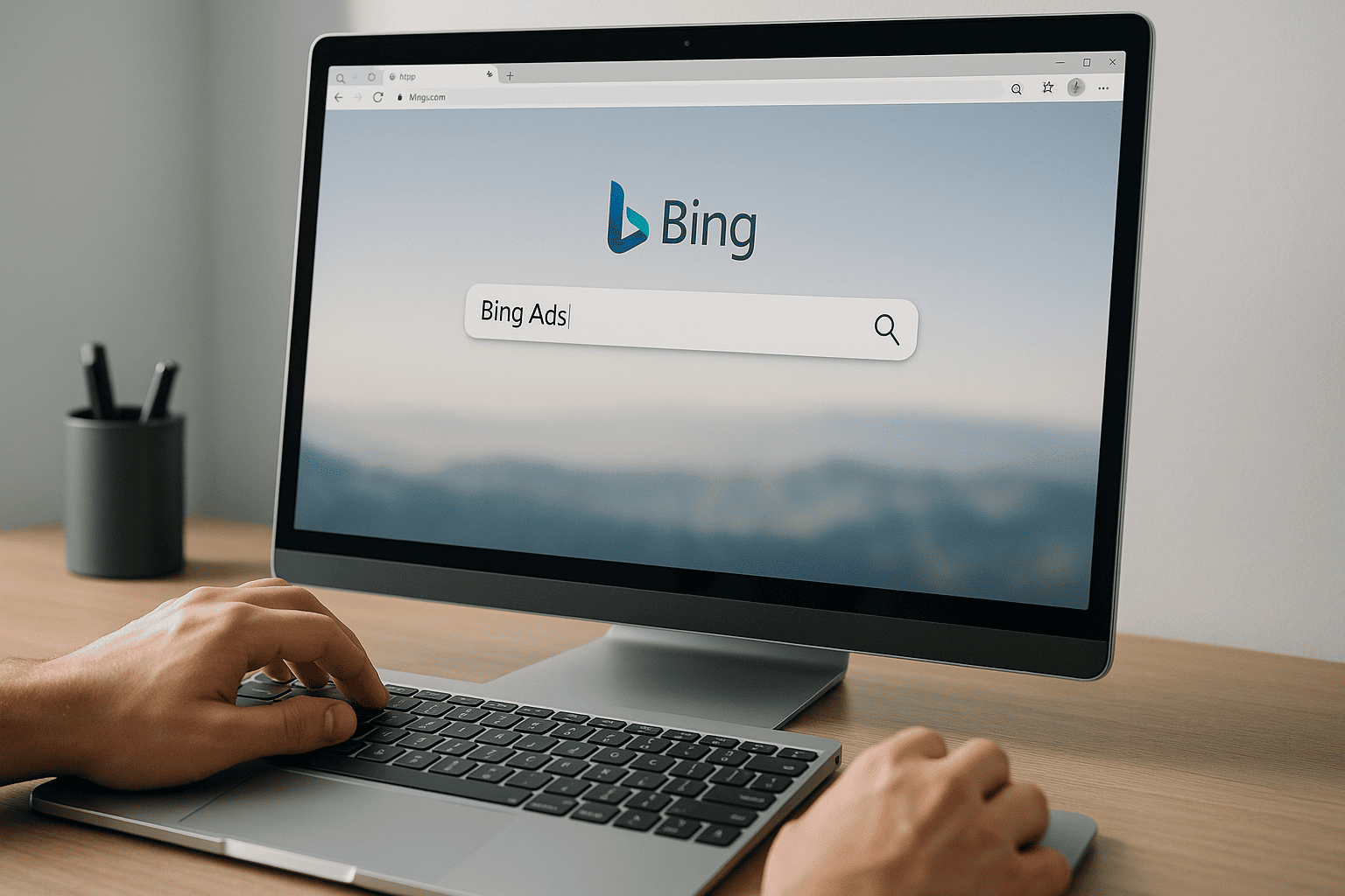 Person working on computer with bing search open in browser