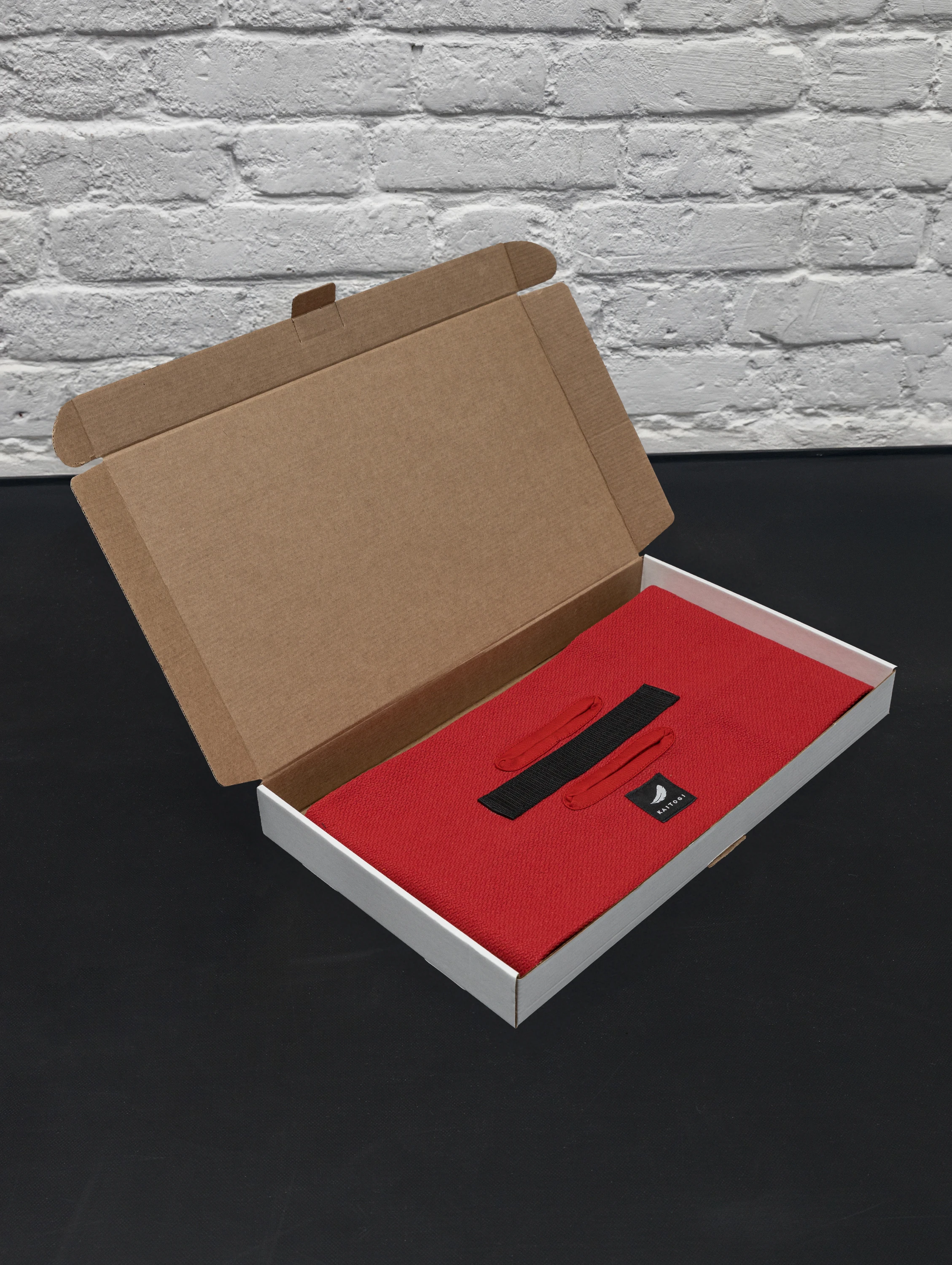 Красный тренажер ГРИФ в фирменной коробке, готовый к отправке