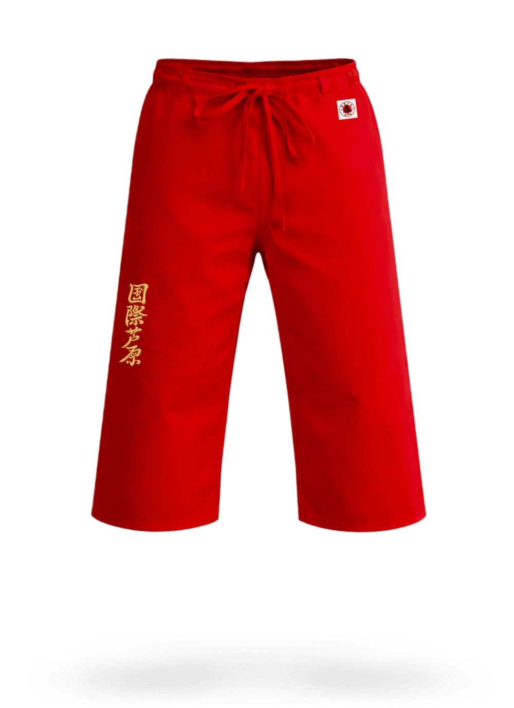 Красные штаны для ашихара-карате AIKO М4 на завязках: модель ниже колена с золотым иероглифом и жаккардовой этикеткой AIKO