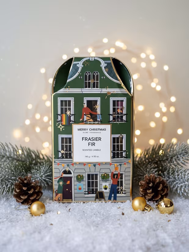Green decorative candle box designed like a three-story building with holiday-themed illustrations.