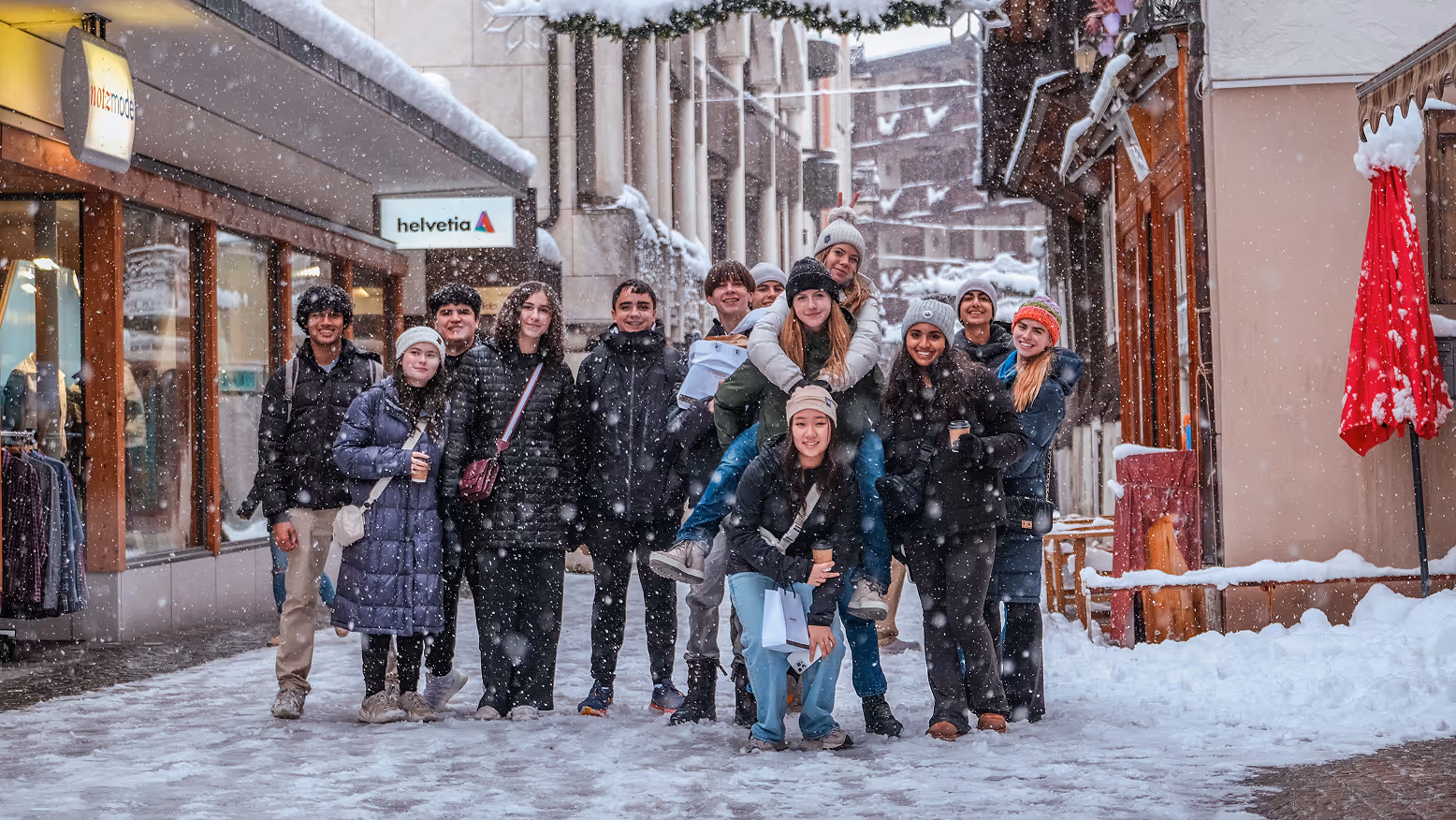 Cary Academy students exploring snowy streets during experiential learning trip to Switzerland.
