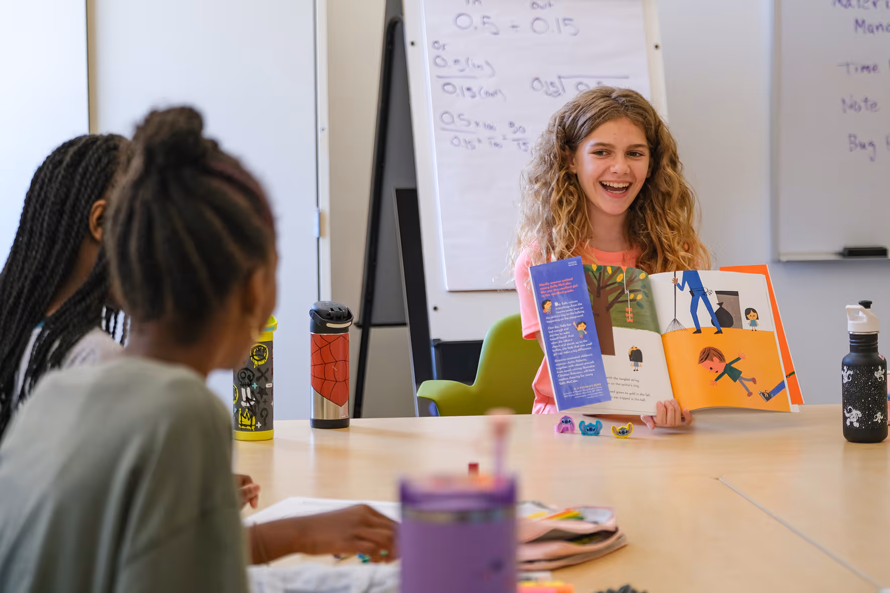 Cary Academy students sharing smiles and connection during Middle School Community Day outdoor event.