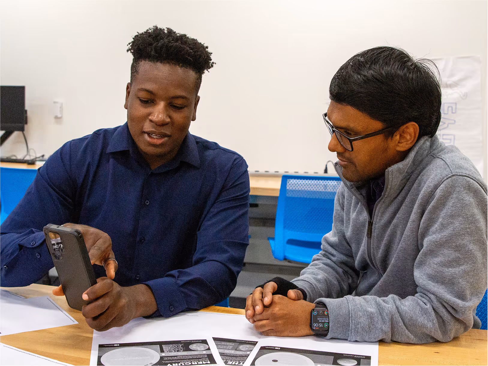 Two students discussing a project