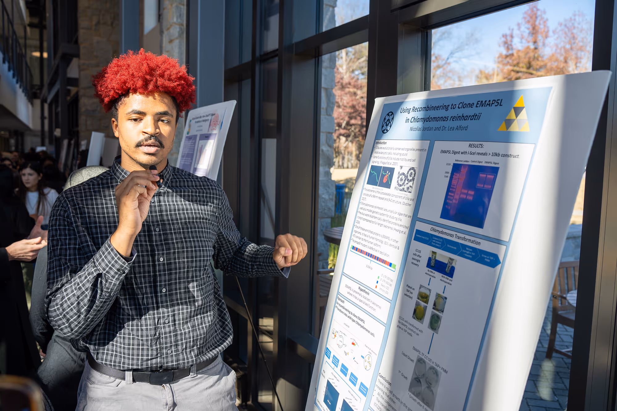 Student presenting their science poster