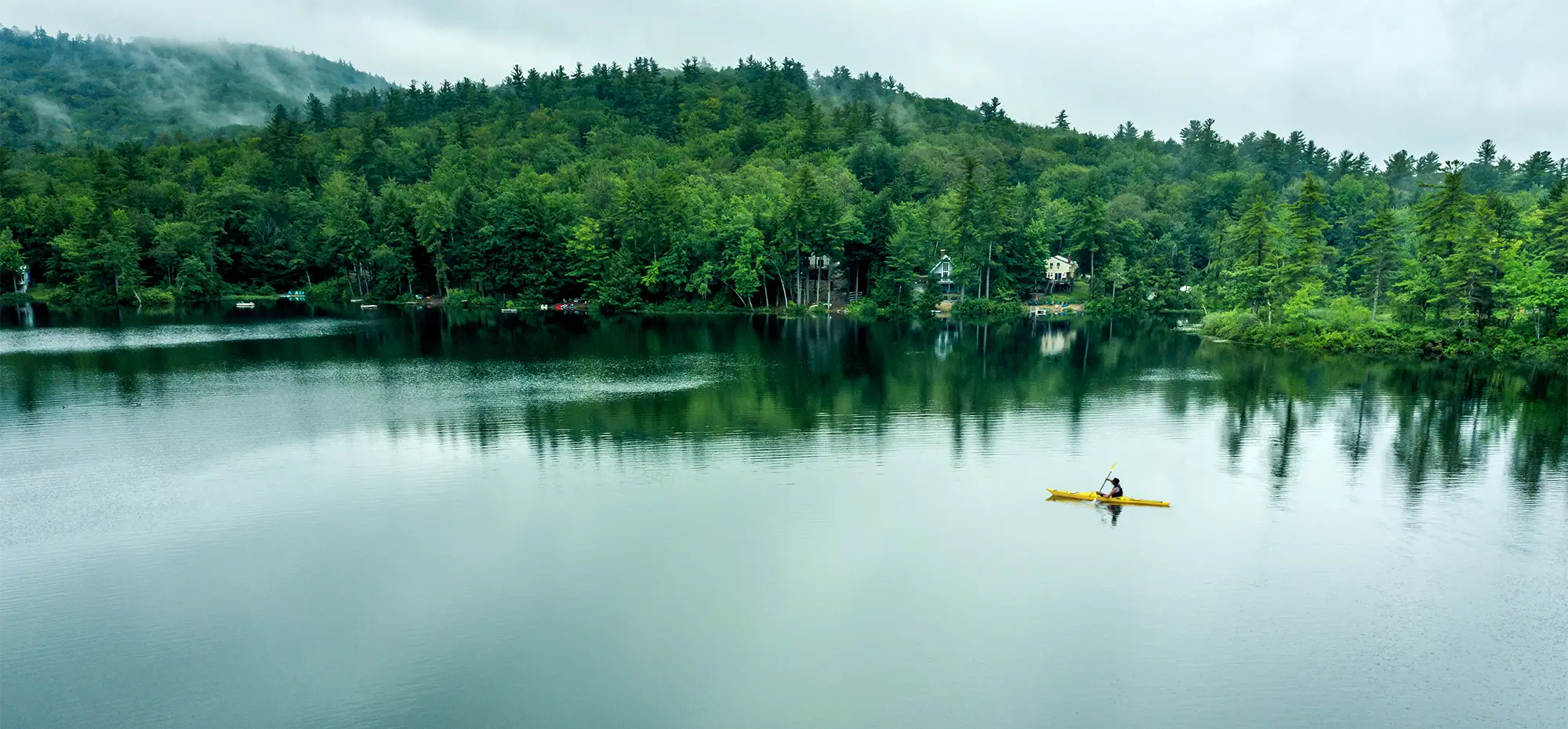 Peaceful lake with kayaker