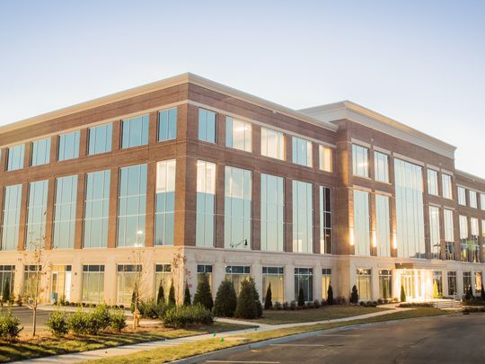 Front view of four-story office building at Berry Farms in Franklin, TN, a milestone project built by Bock Construction.