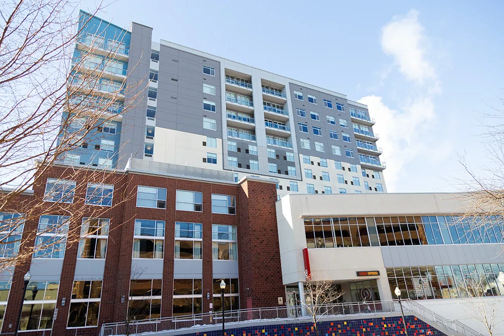 Front entry view of the 12-story Fraser Center mixed-use building in State College, PA, constructed by Bock Construction.