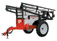 Red and gray agricultural sprayer machine with large tires and extended boom arms.