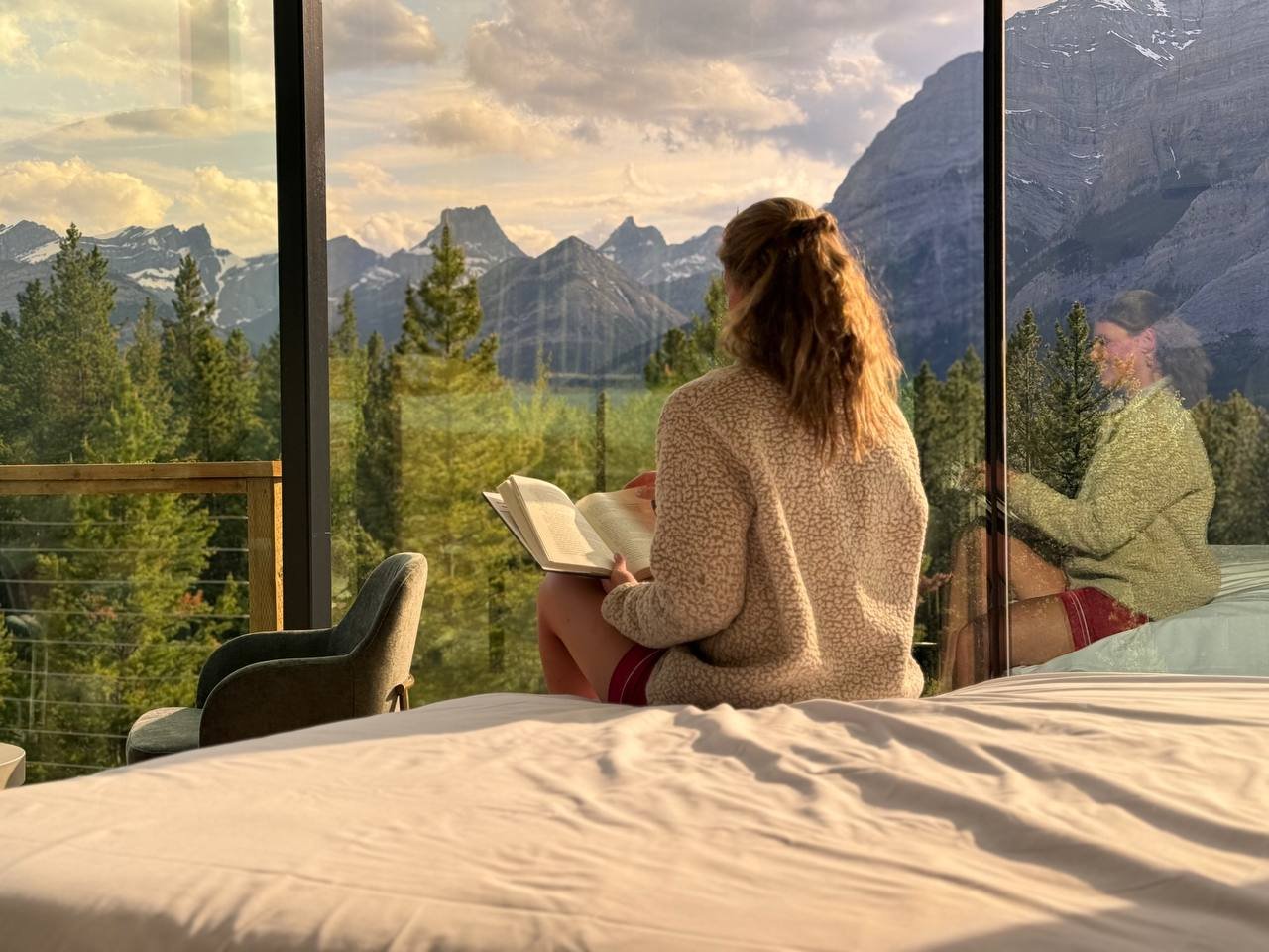 Woman reading and enjoying SkyGlass Room View