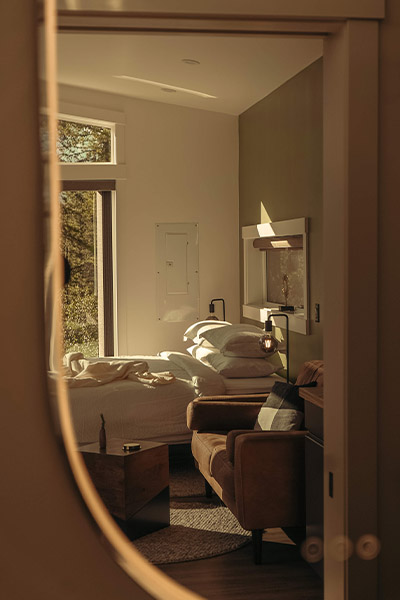 bathroom mirror reflecting the inside of a cabin