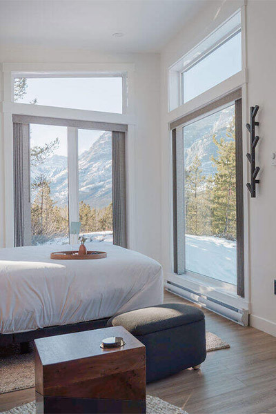 bed and door of a skybox cabin
