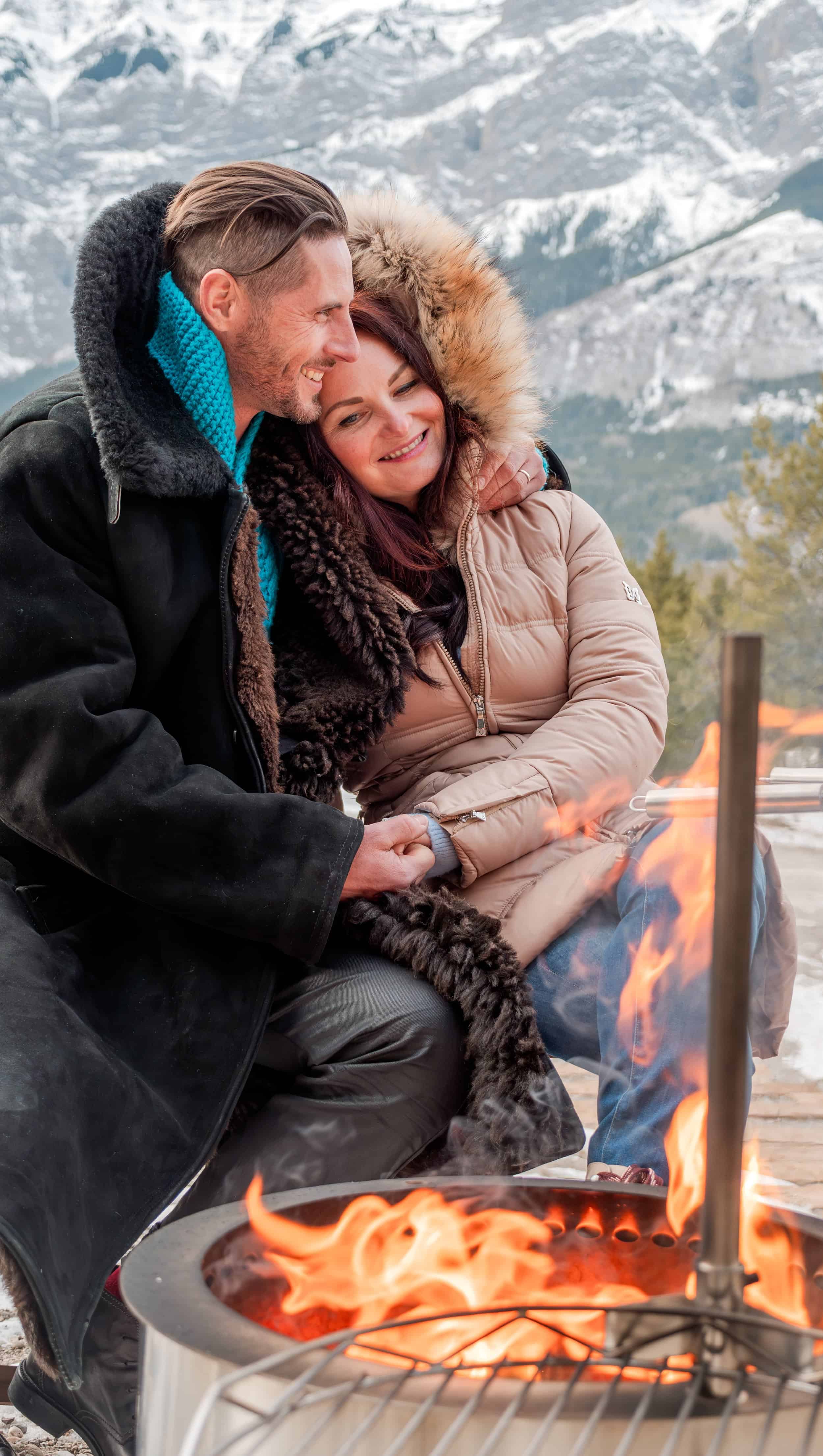Couple next to a firepit at skyridge
