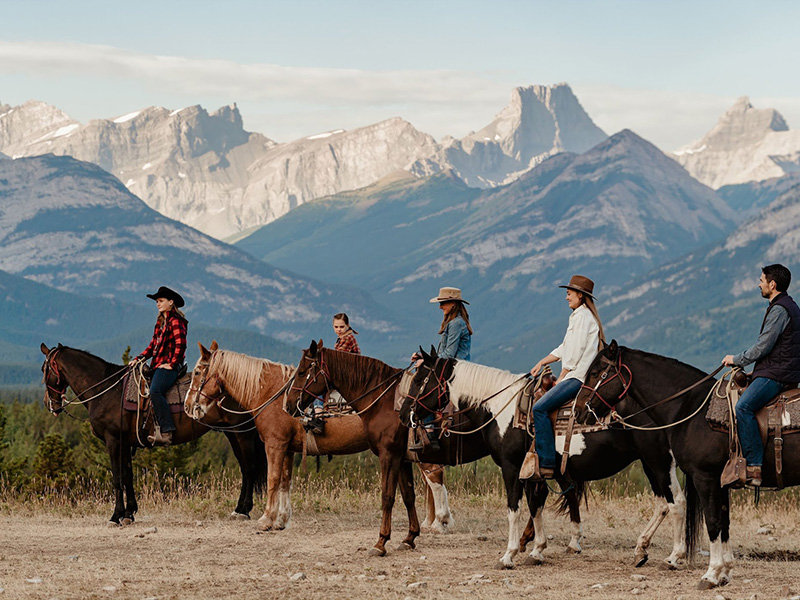 Group of tourists being guided on a horseback riding tour