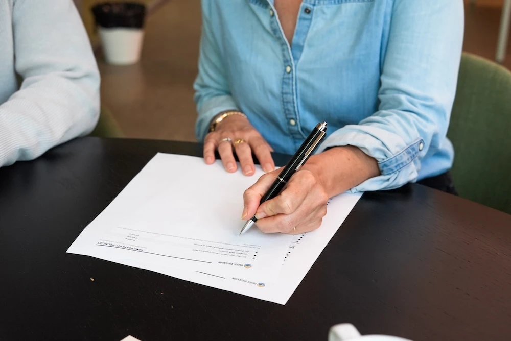 Relocation consultant reviewing a personalized moving plan with a client