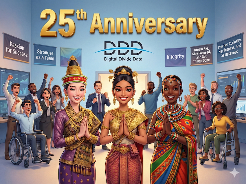 Diverse group celebrating Digital Divide Data's 25th anniversary with three women in traditional attire at the front and supportive colleagues in the background.