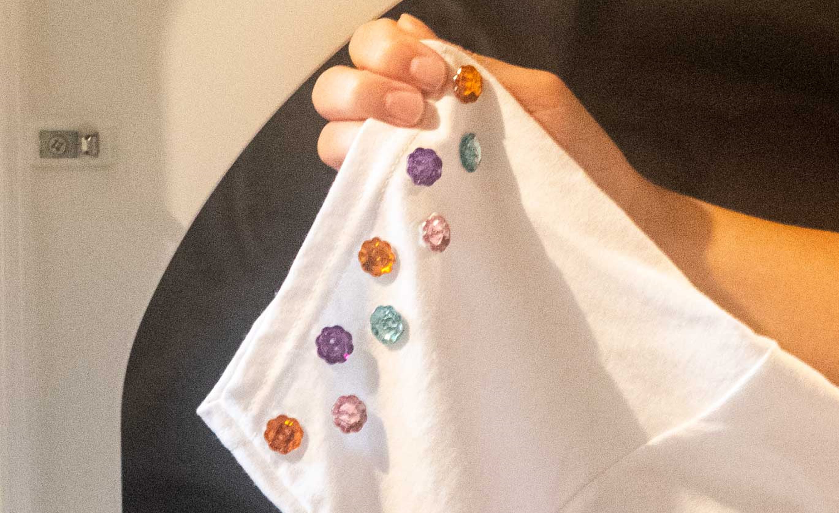 White fabric decorated jewel embellishments.