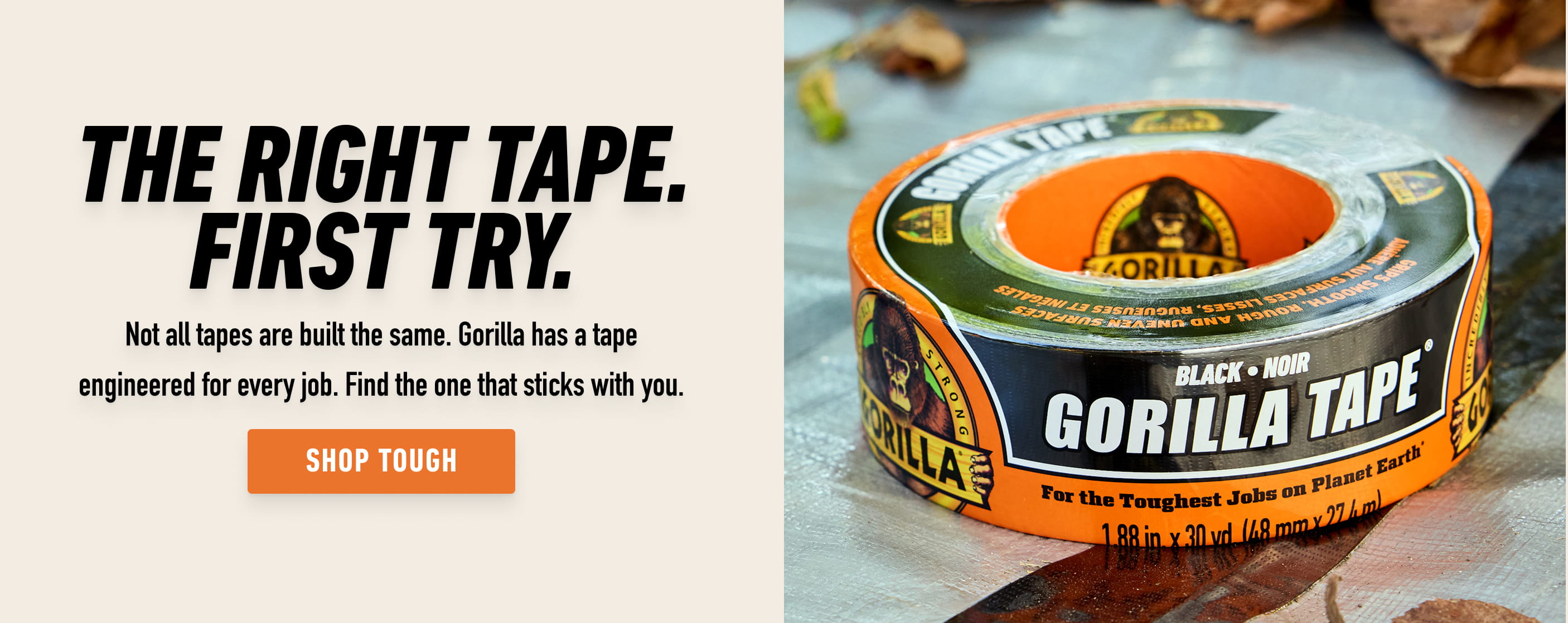 Roll of black Gorilla Tape with orange and black label on a surface with fallen leaves nearby.