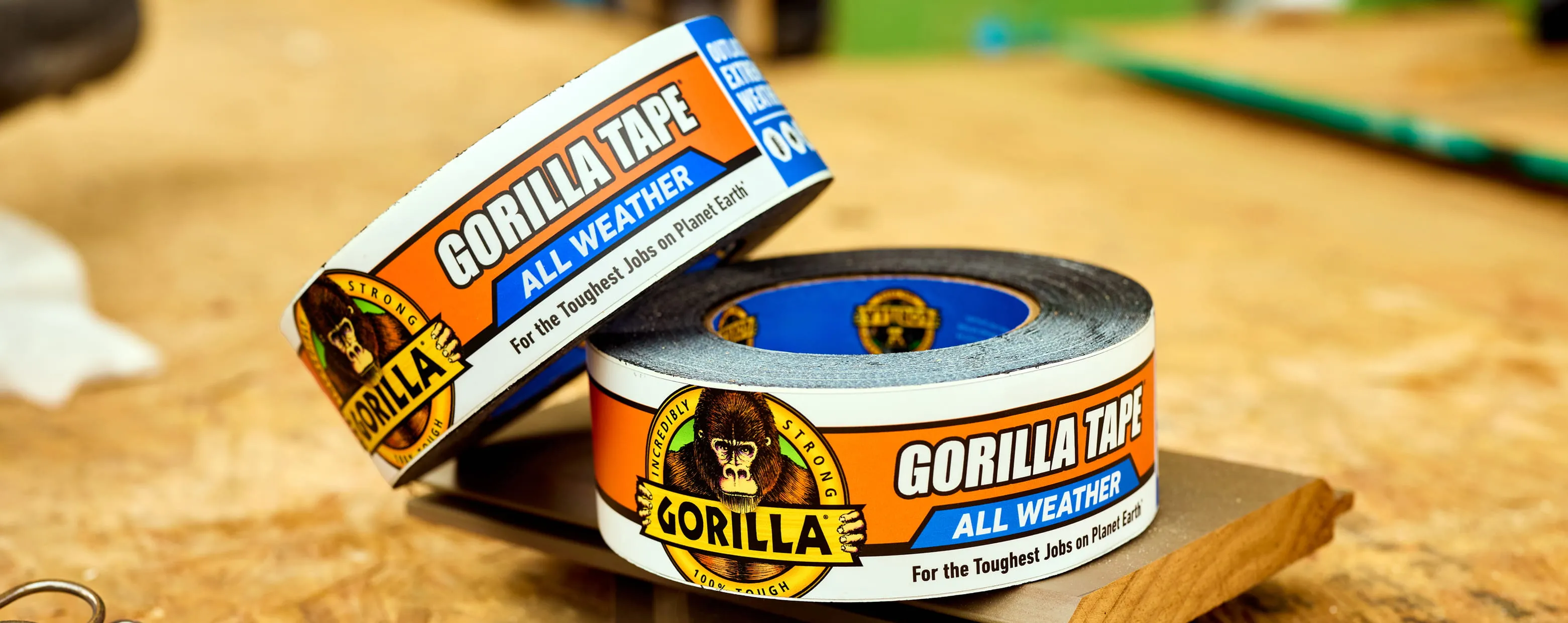 Two rolls of Gorilla Tape on a wooden surface.