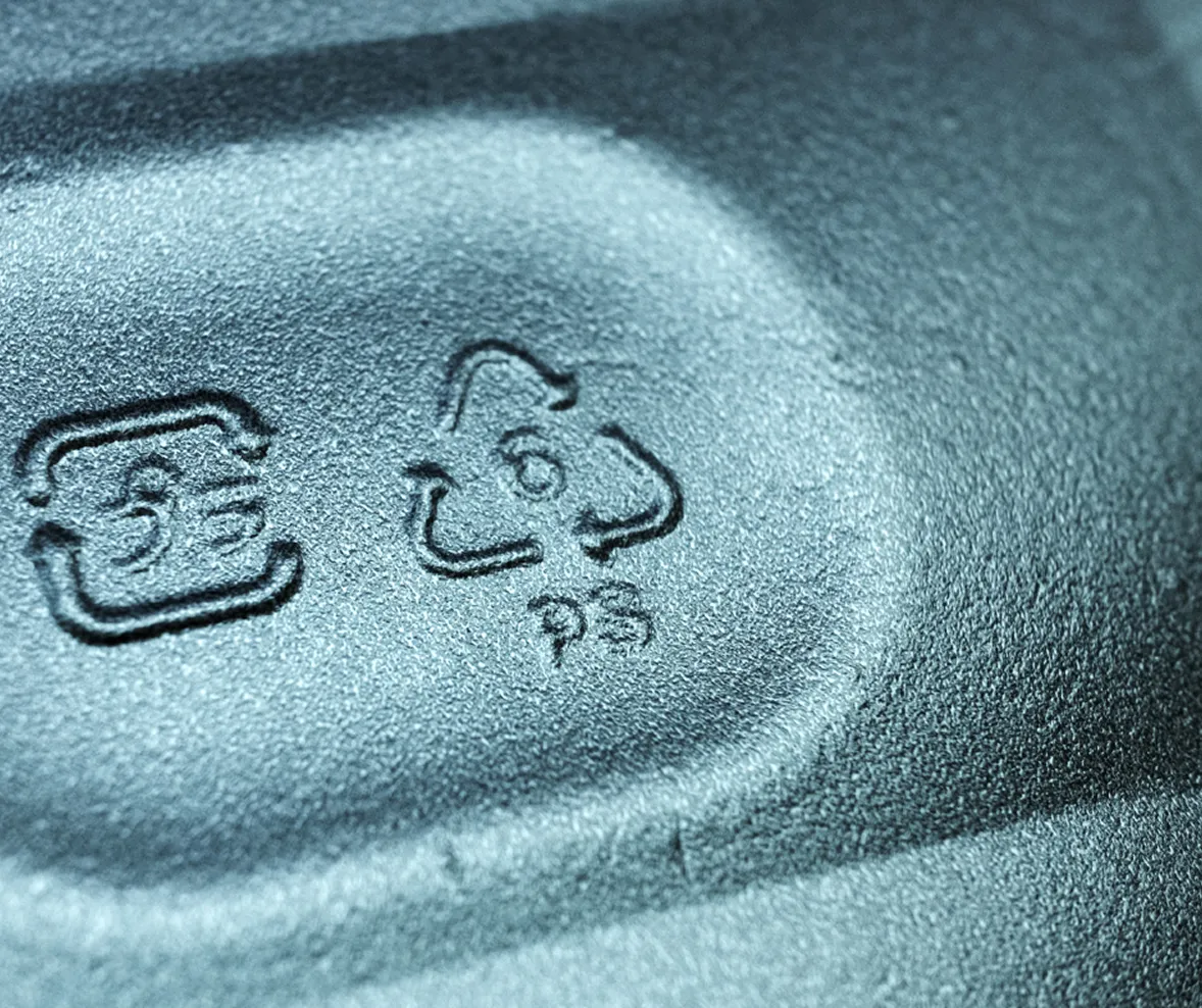 Close-up of a plastic recycling symbol.