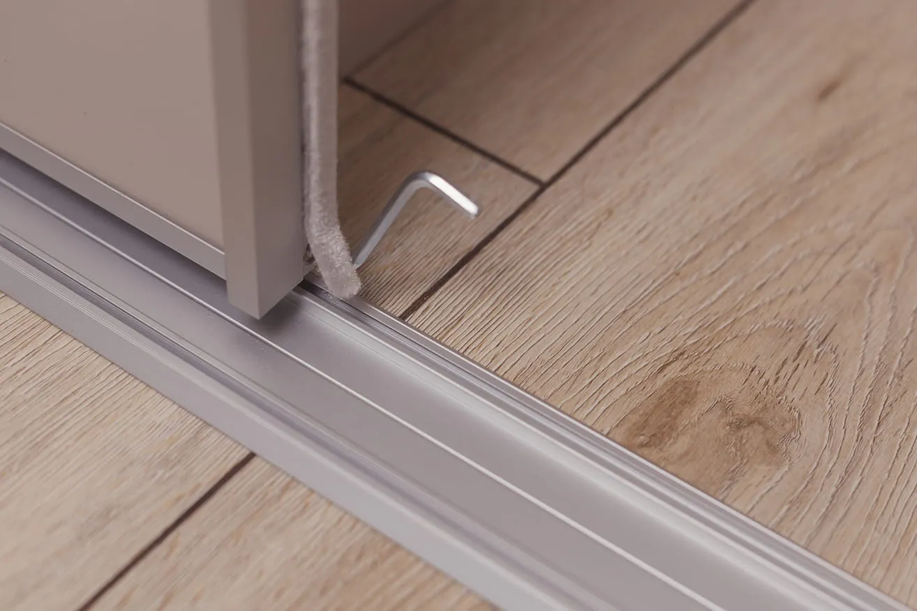 Sliding wardrobe door with rubber liner.