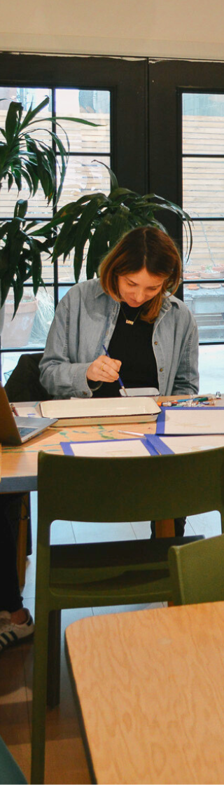 woman at desk in recess grove