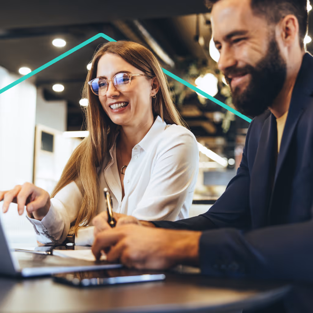 Couple at desk with laptop