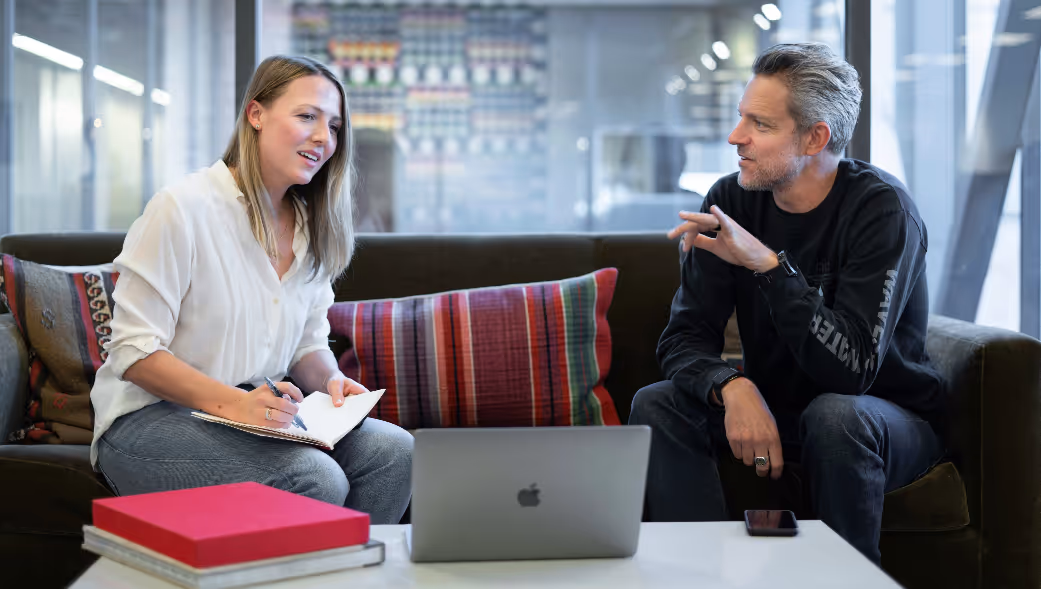 Sales professionals sitting talking