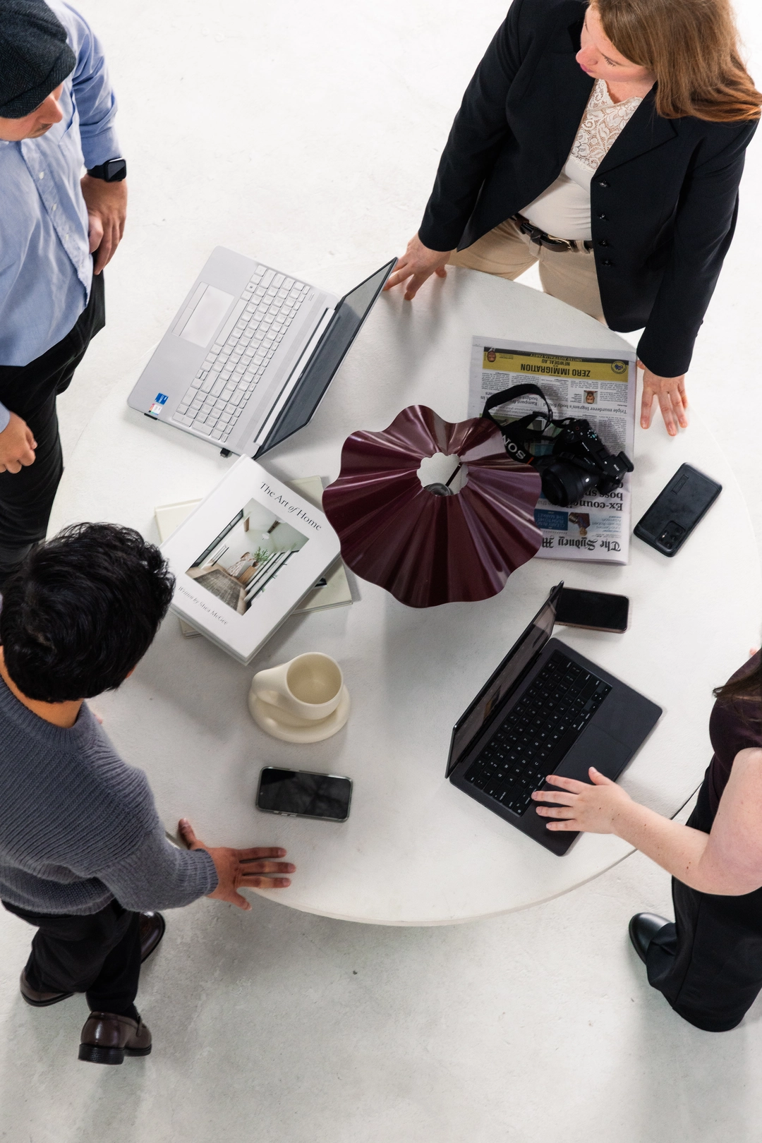 Members of the Adcraft Studio marketing team discussing campaign work together.