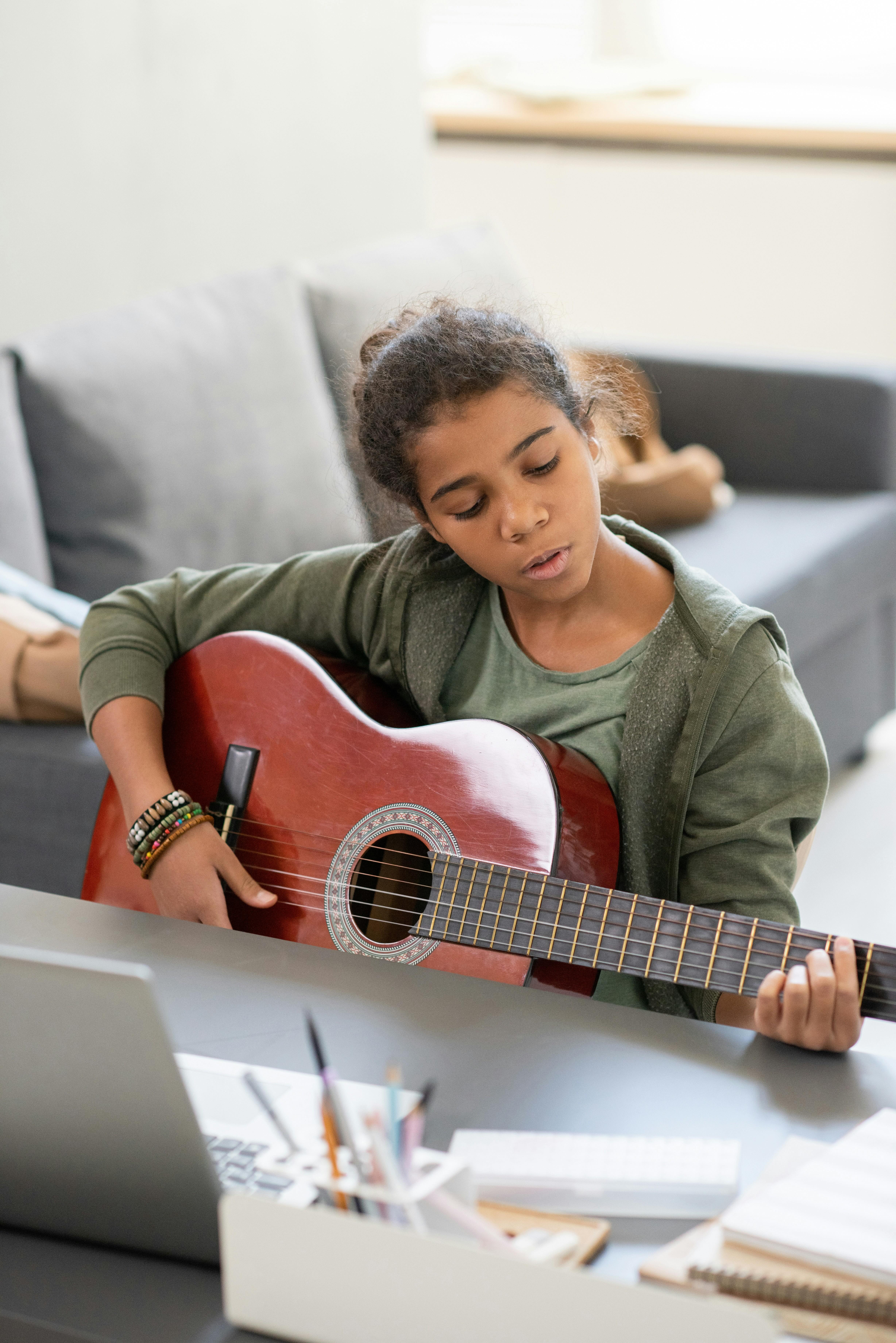 Child playing guitar