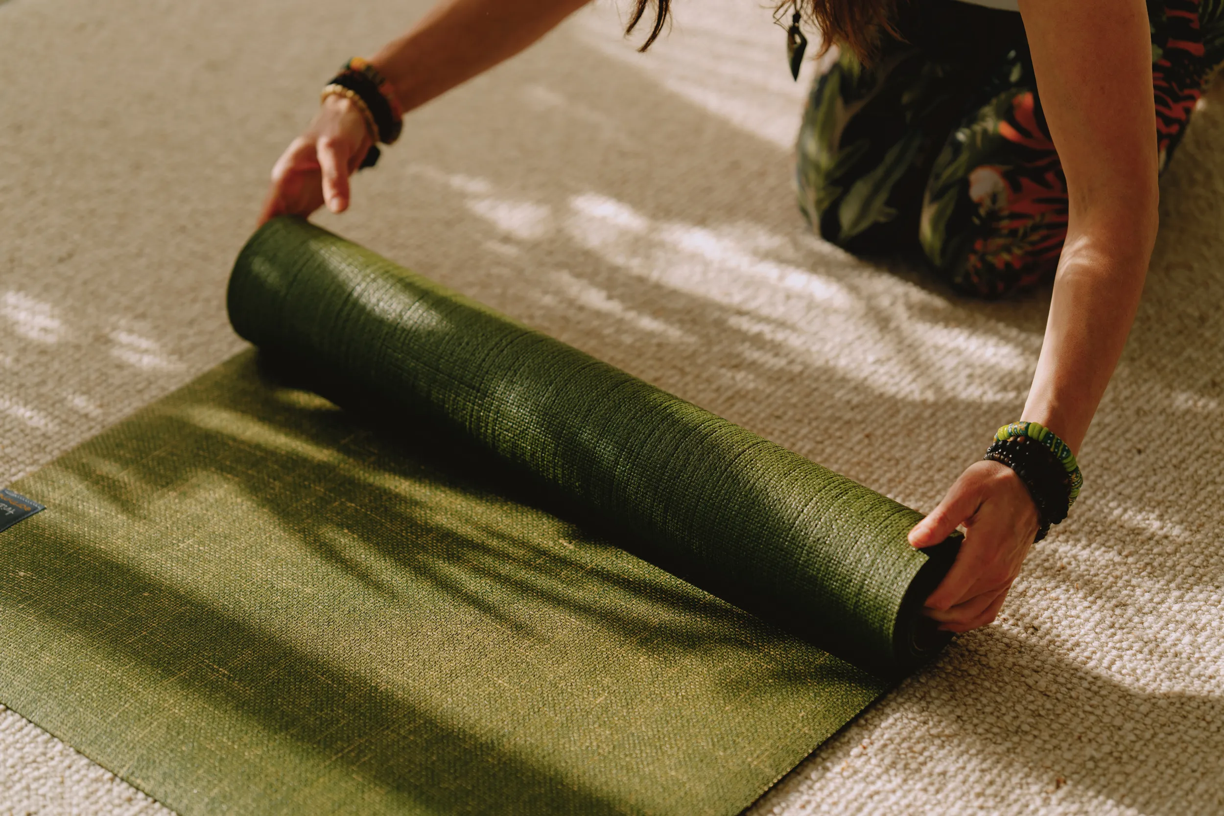 Rolling out yoga mat