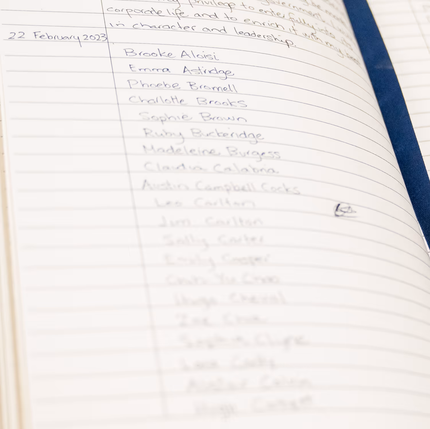 Open notebook page with handwritten names and the date 22 February 2023 on the left margin.